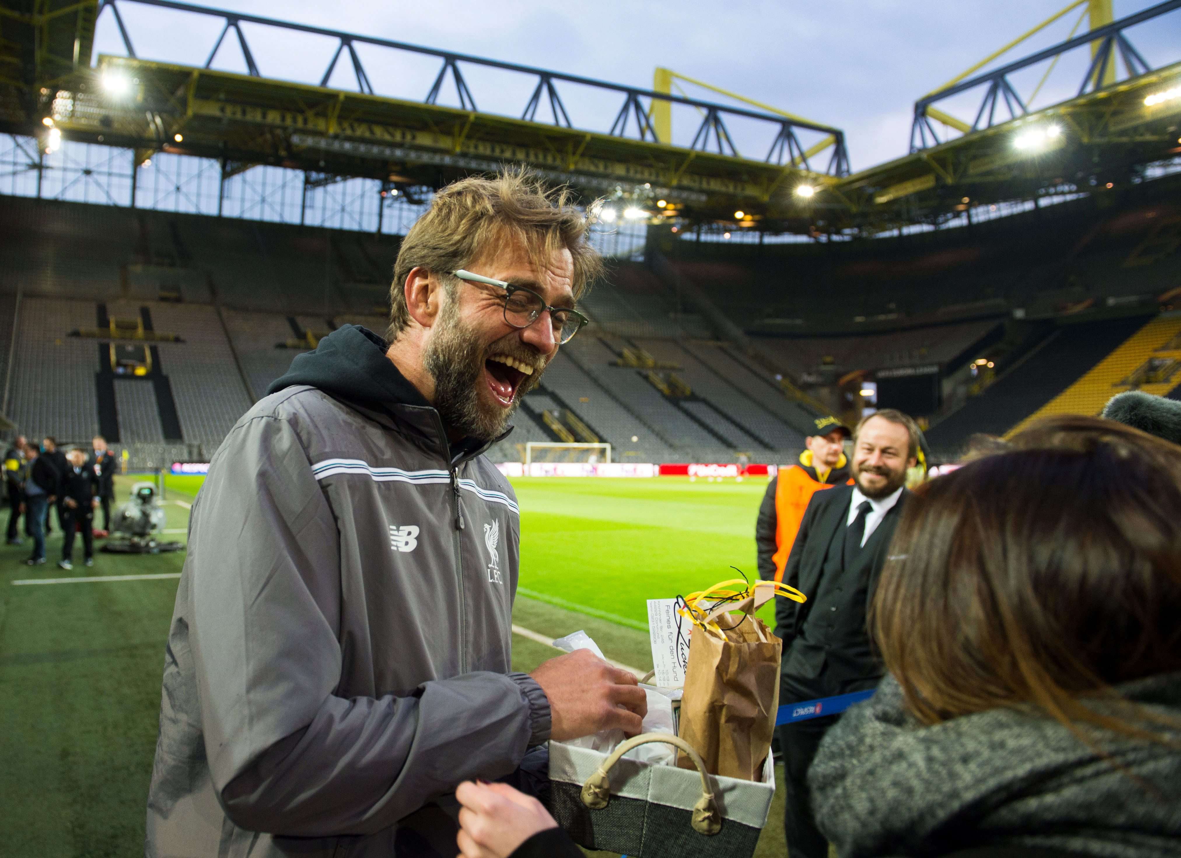 Liverpool manager Juergen Klopp signs autographs on his return to Signal Iduna Park in Dortmund. Photo: EPA