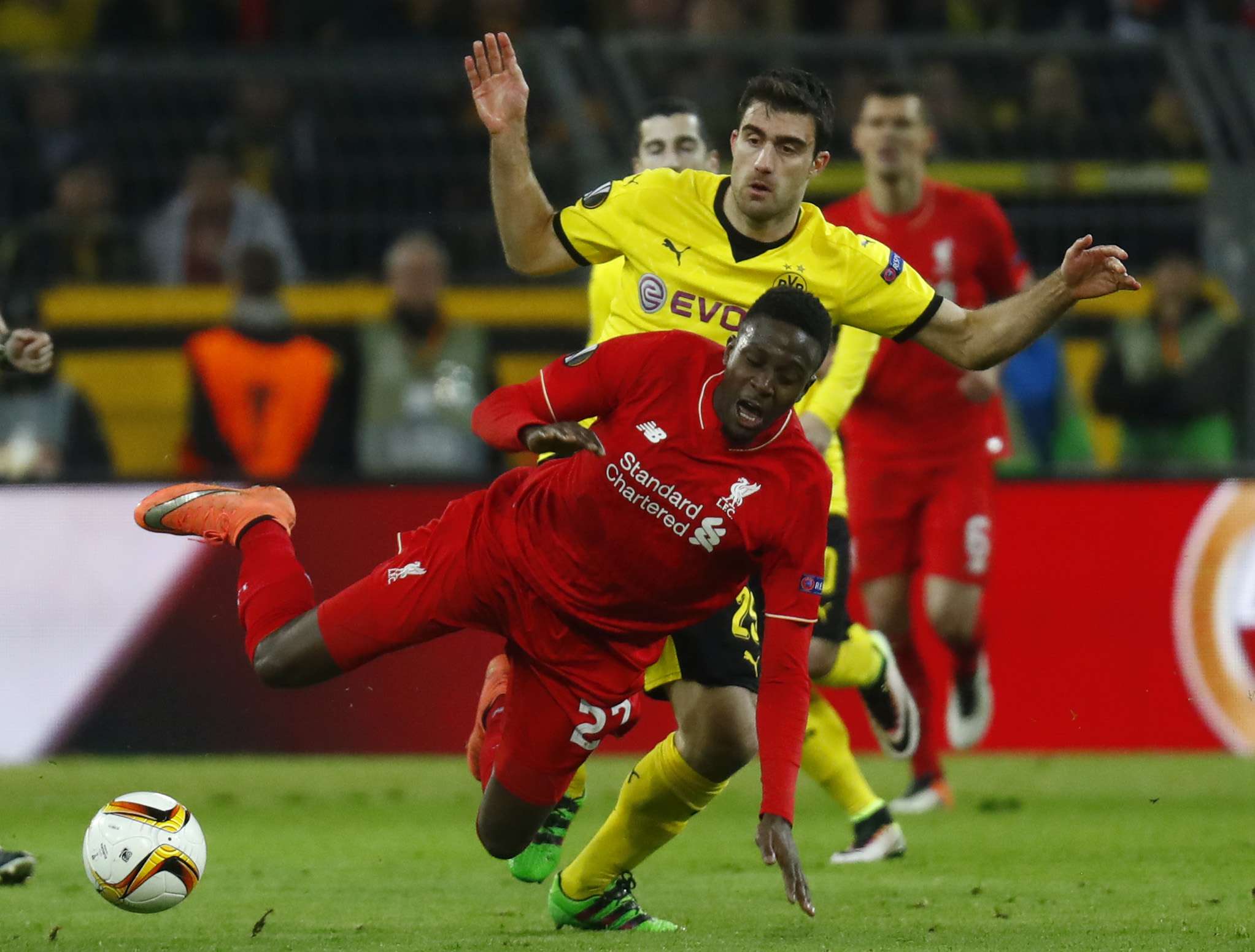 Liverpool's Divock Origi is fouled by Borussia Dortmund's Sokratis Papastathopoulos. Photo: Reuters