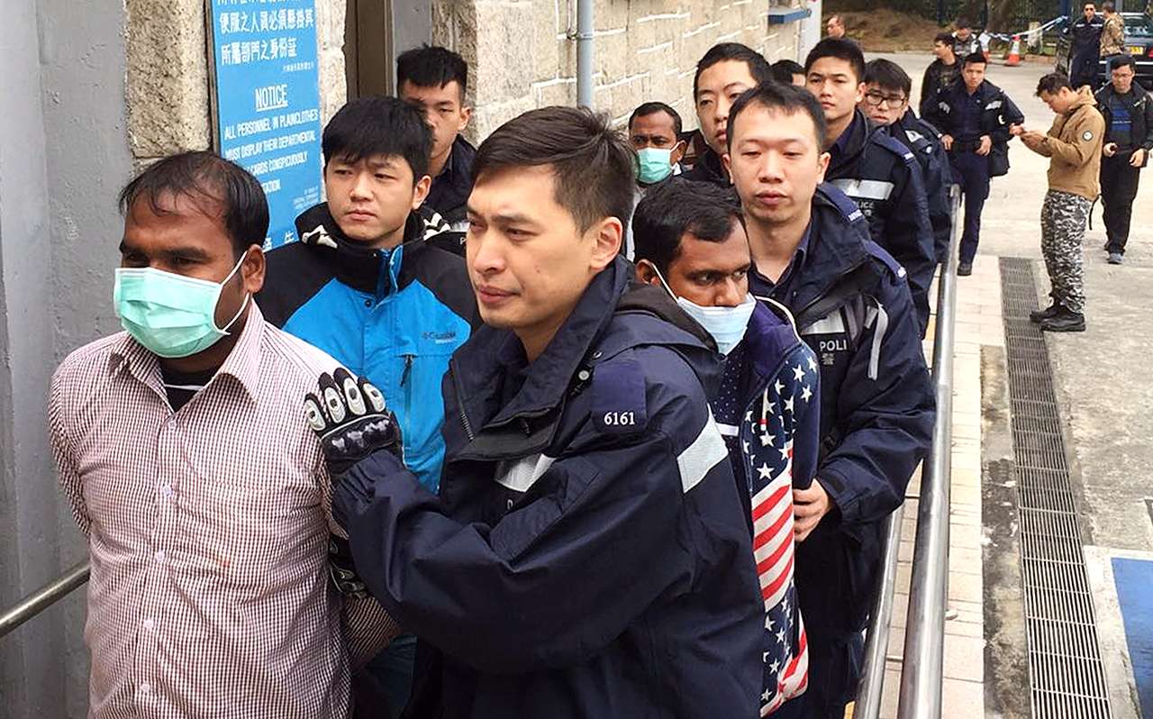 Illegal immigrants held in a joint operation. Photo: SCMP Pictures