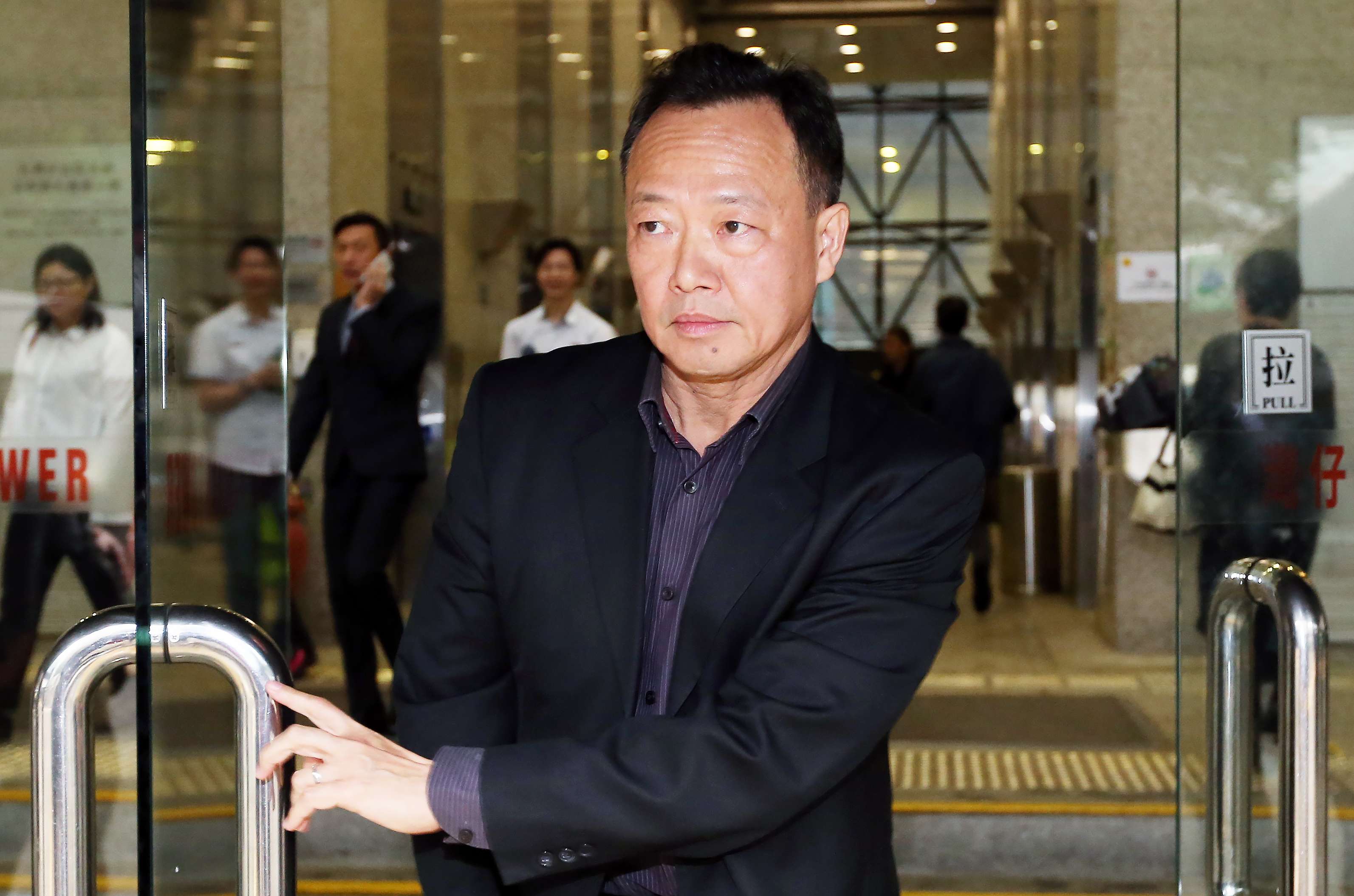 Assistant Director of Marine So Ping-chi leaves the District Court in Wan Chai. Photo: K. Y. Cheng