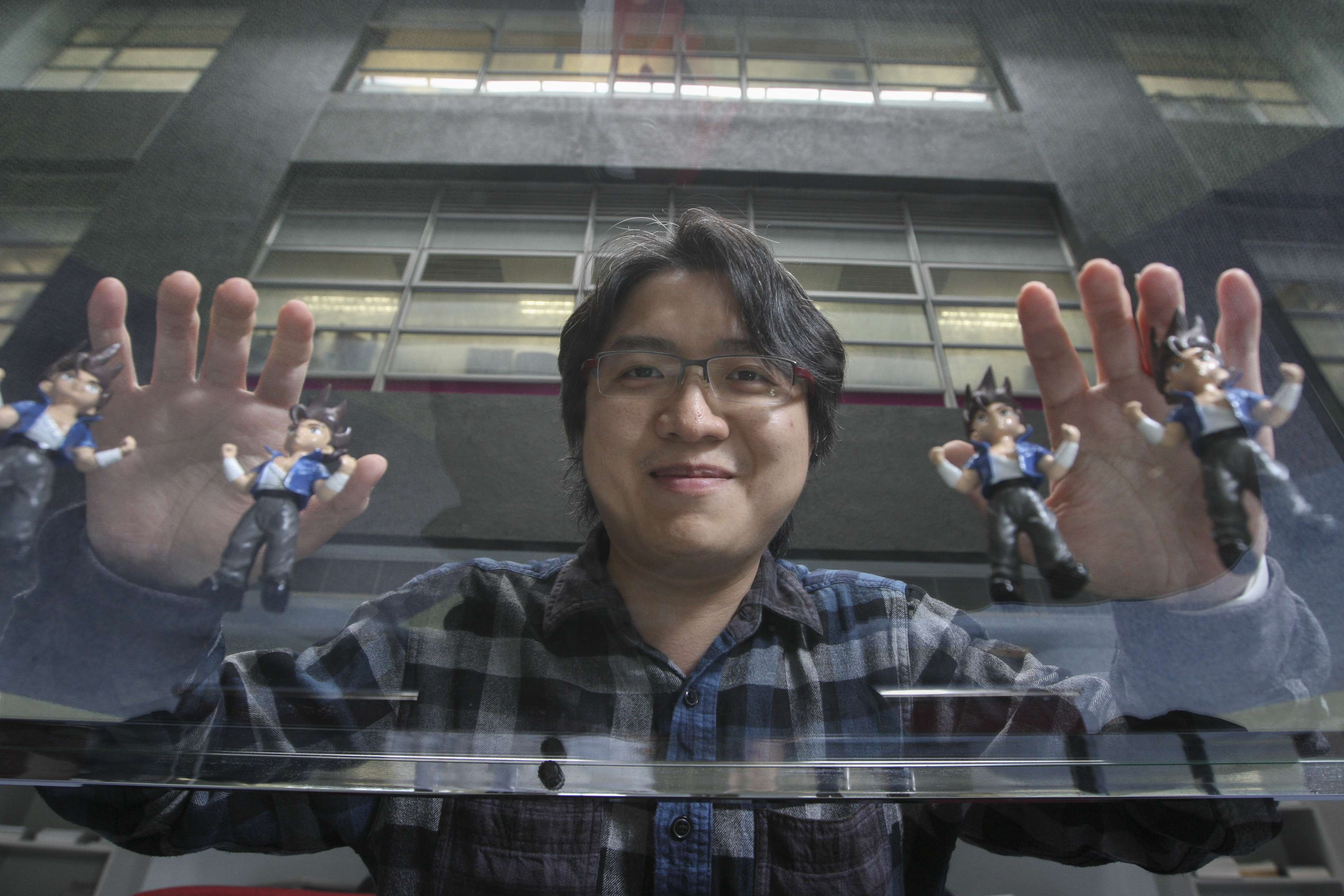 Game designer Marti Wong Kwok-hung with Little Fighter 2 dolls. Photo: Bruce Yan