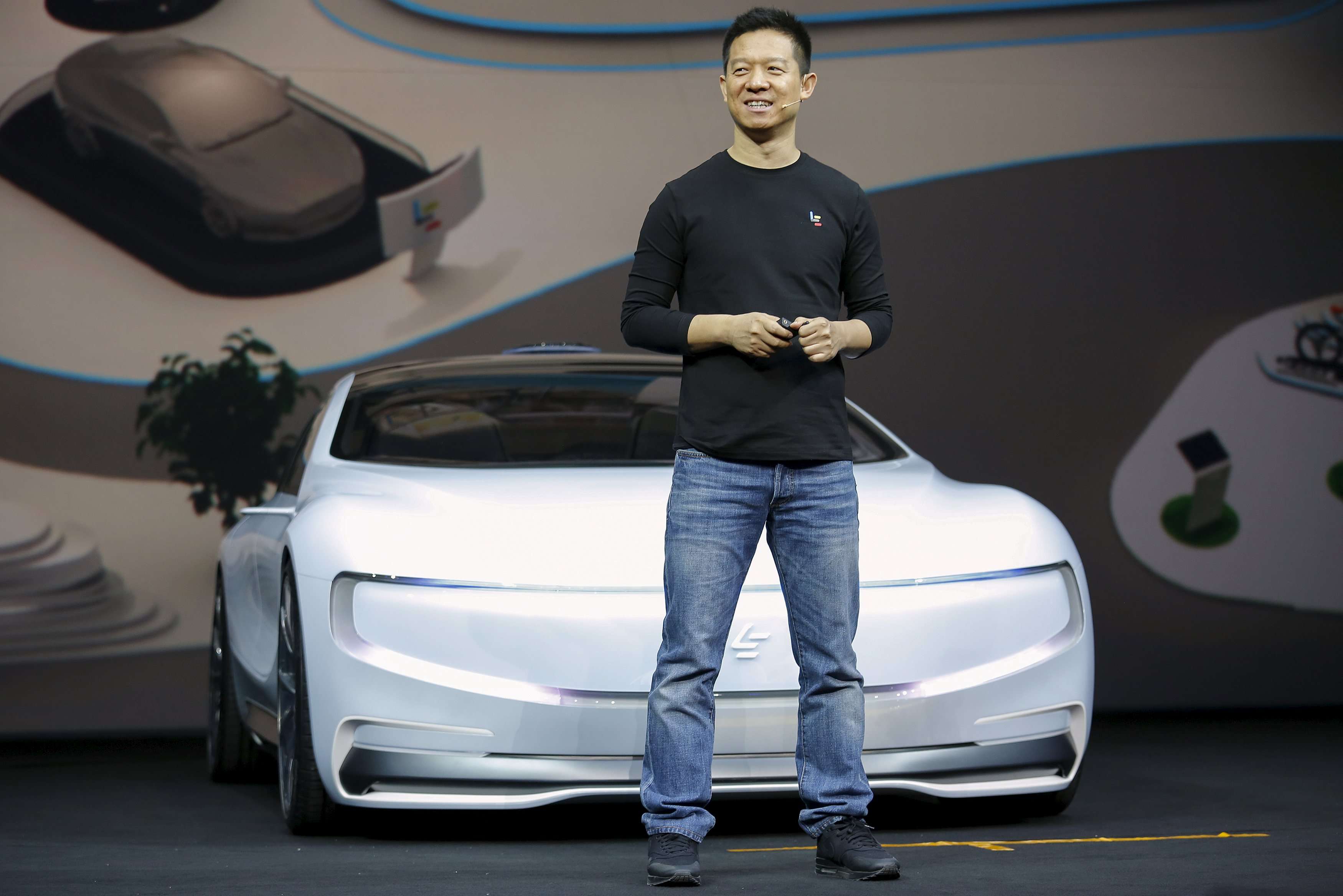 Jia Yueting, co-founder and head of Le Holdings, unveils an all-electric battery ’concept’ car called LeSEE in Beijing. Reuters