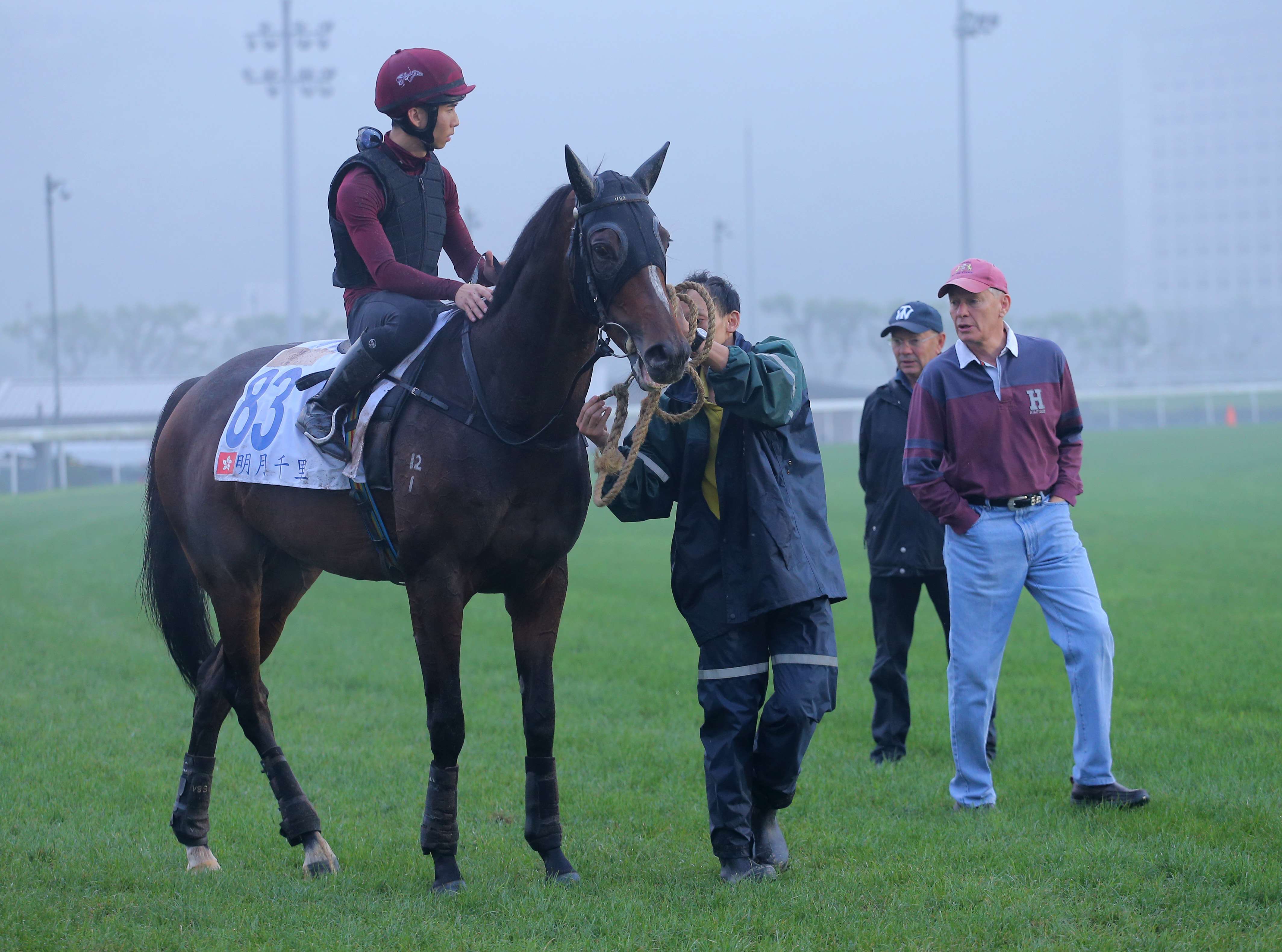 Rider Thomas Yeung gets instructions from trainer John Moore before taking Hong Kong Derby winner Werther for his final gallop ahead of Sunday’s Audemars Piguet QE II Cup. Photo: Kenneth Chan
