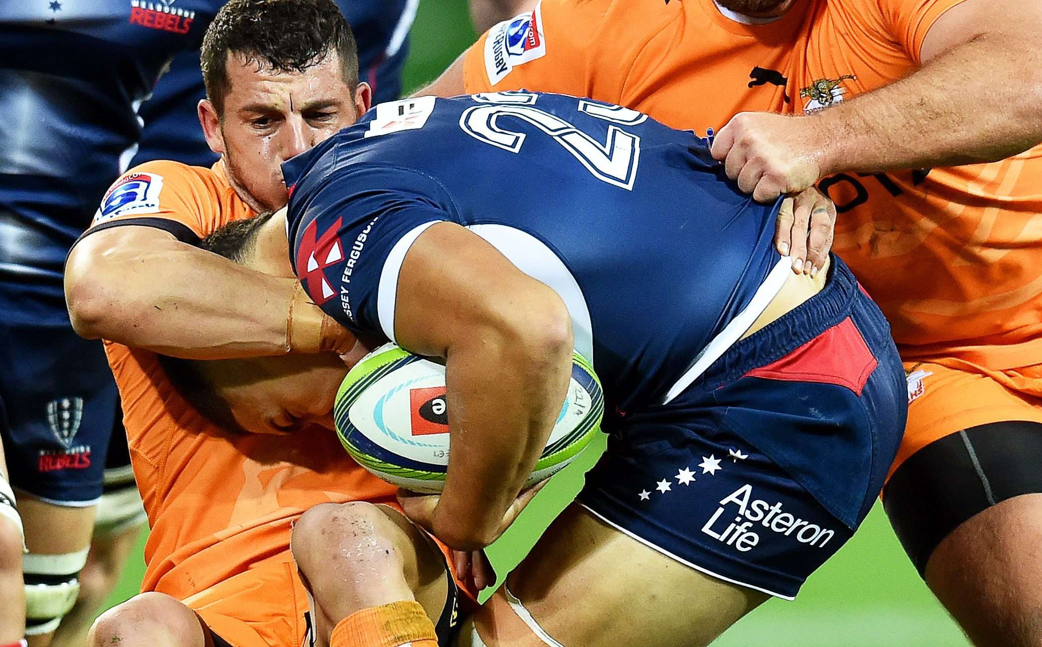 Shaun Venter of the Cheetahs tackles Sione Tuipulotu of the Rebels during their Super Rugby match at AAMI Park in Melbourne on Friday night. Photo: EPA