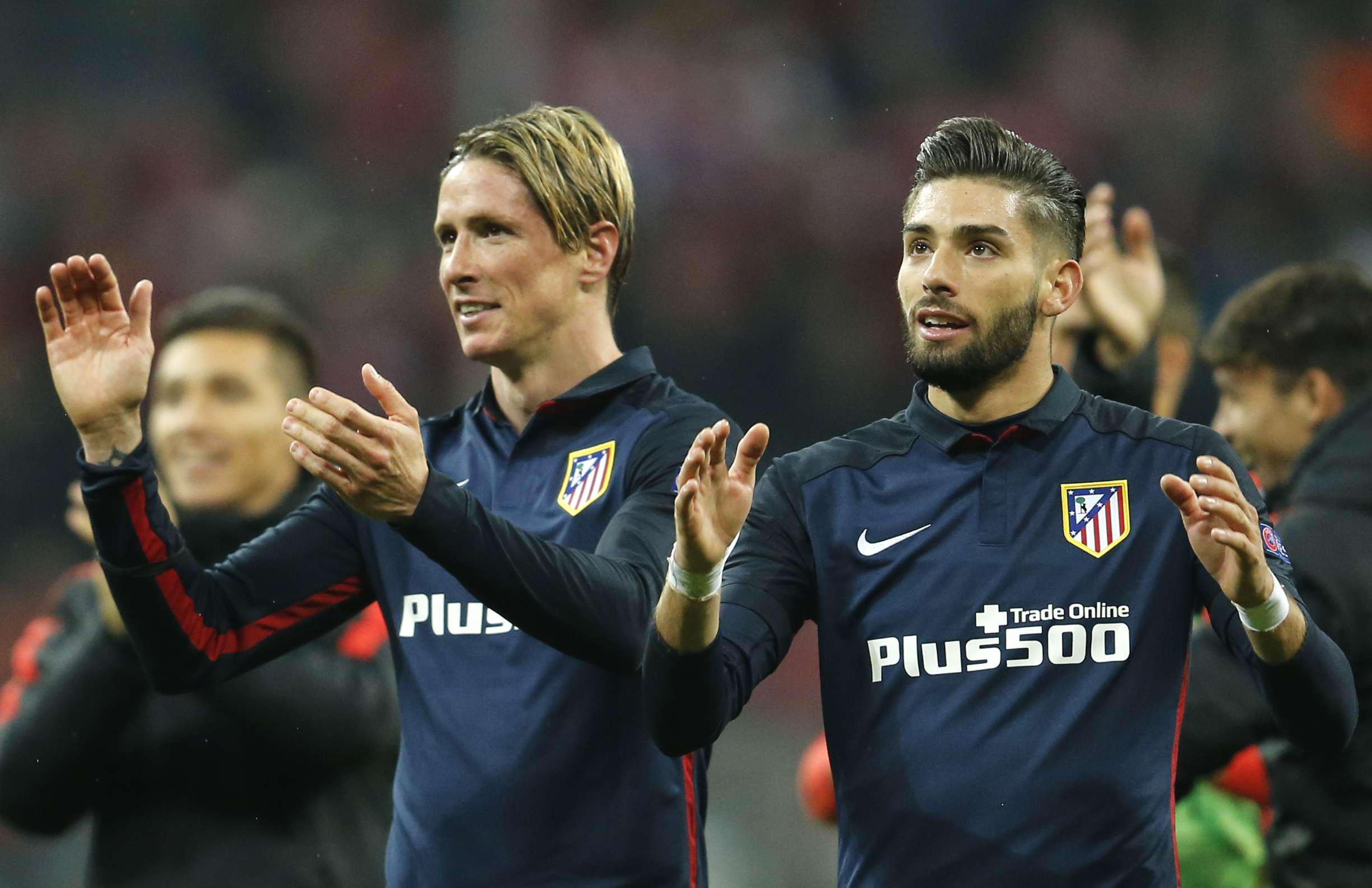 Atletico's Fernando Torres, left, celebrates with teammate Yannick Carrasco. Photo: AP