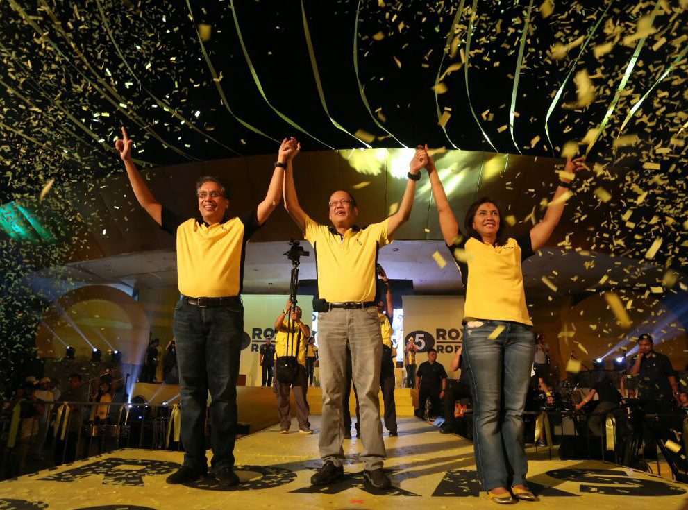 President Benigno Aquino (centre) endorses Mar Roxas (left) and Maria Leonor Robredo. Photo: EPA