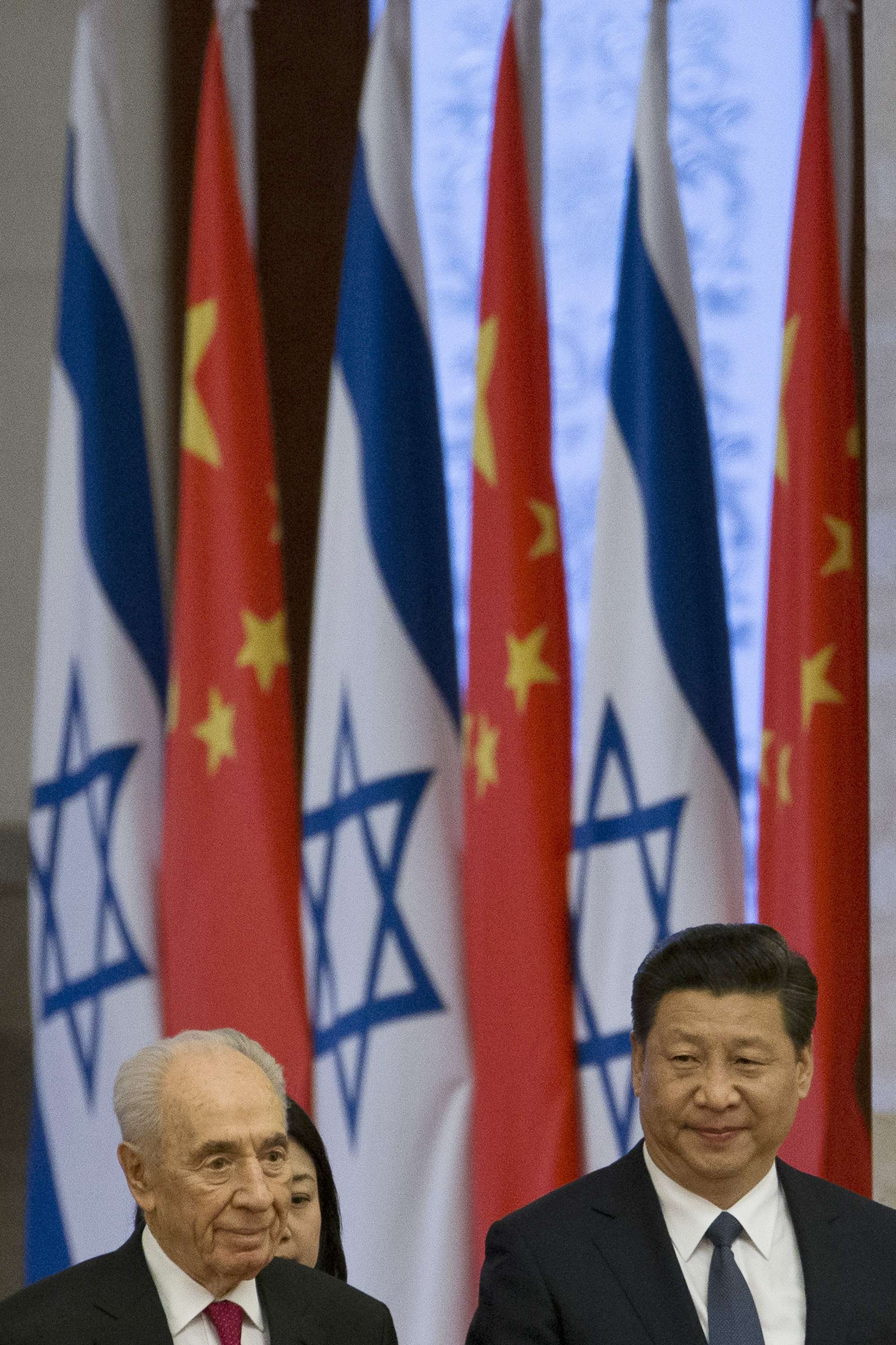 Chinese and Israeli flags. Photo AP, Alexander F. Yuan