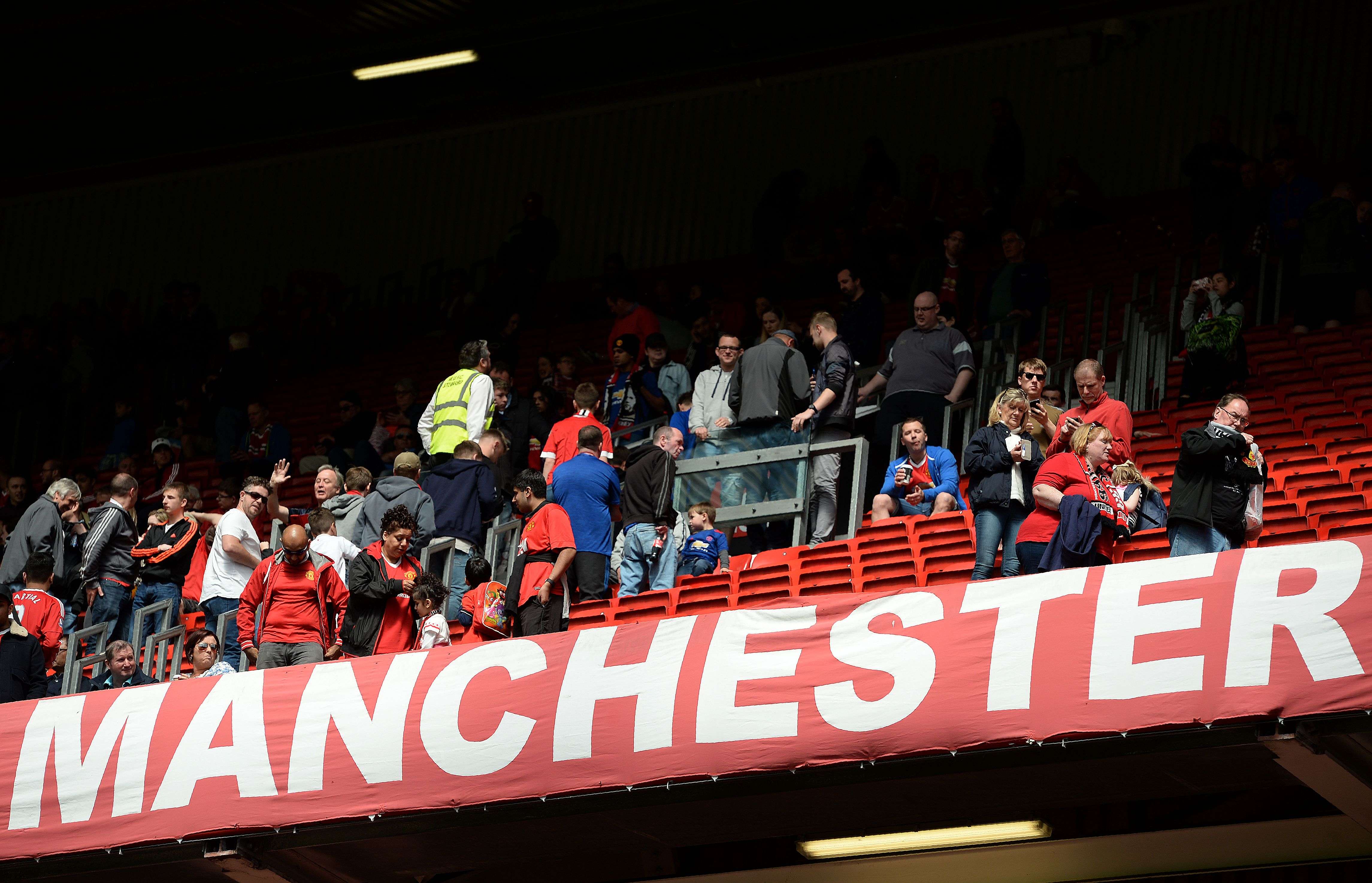 Fans are evacuated from Old Trafford after the Premier League match between Manchester United and Bournemouth was abandoned. Photo: AFP