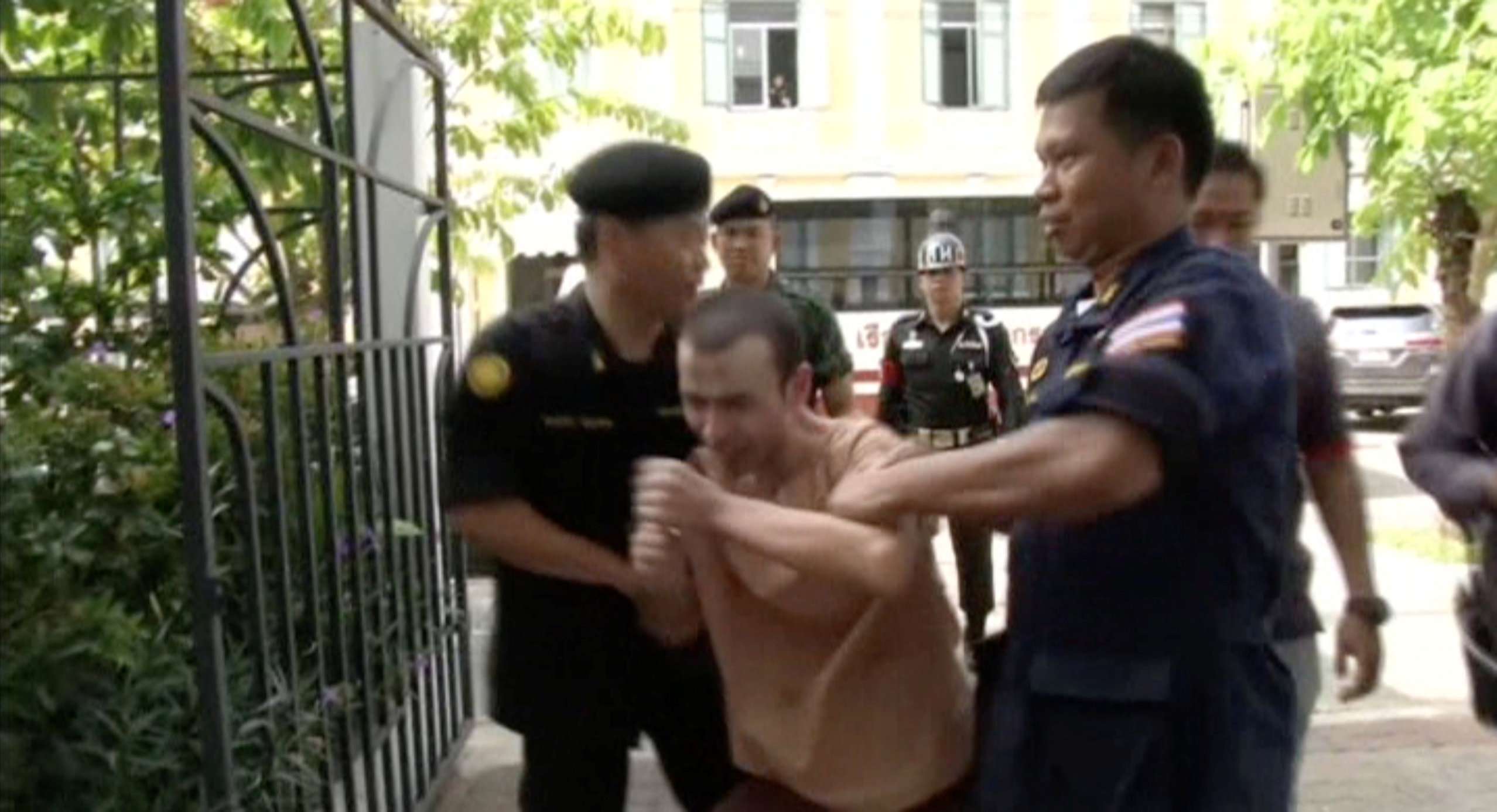 Still image taken from video shows Adem Karadag, also known as Bilal Mohammed, a suspect in last year's Bangkok blast, shouting as he is escorted to court in Bangkok, Thailand, May 17, 2016. REUTERS TV via Reuters ATTENTION EDITORS - FOR EDITORIAL USE ONLY. THIS IMAGE HAS BEEN SUPPLIED BY A THIRD PARTY. IT IS DISTRIBUTED, EXACTLY AS RECEIVED BY REUTERS, AS A SERVICE TO CLIENTS.