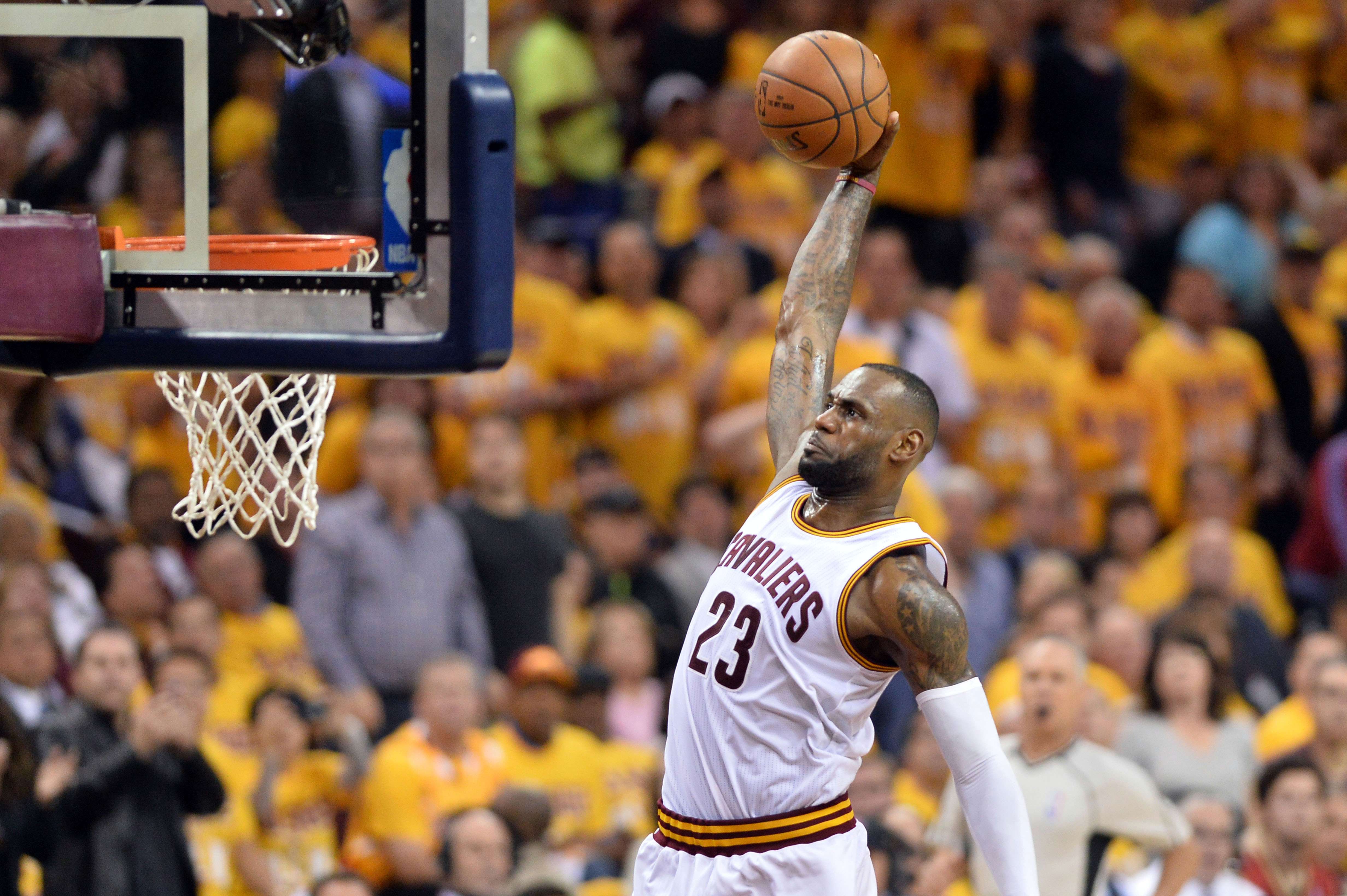 The Cavaliers’ LeBron James slam dunks during the third quarter against the Toronto Raptors in game one. Photo: USA Today