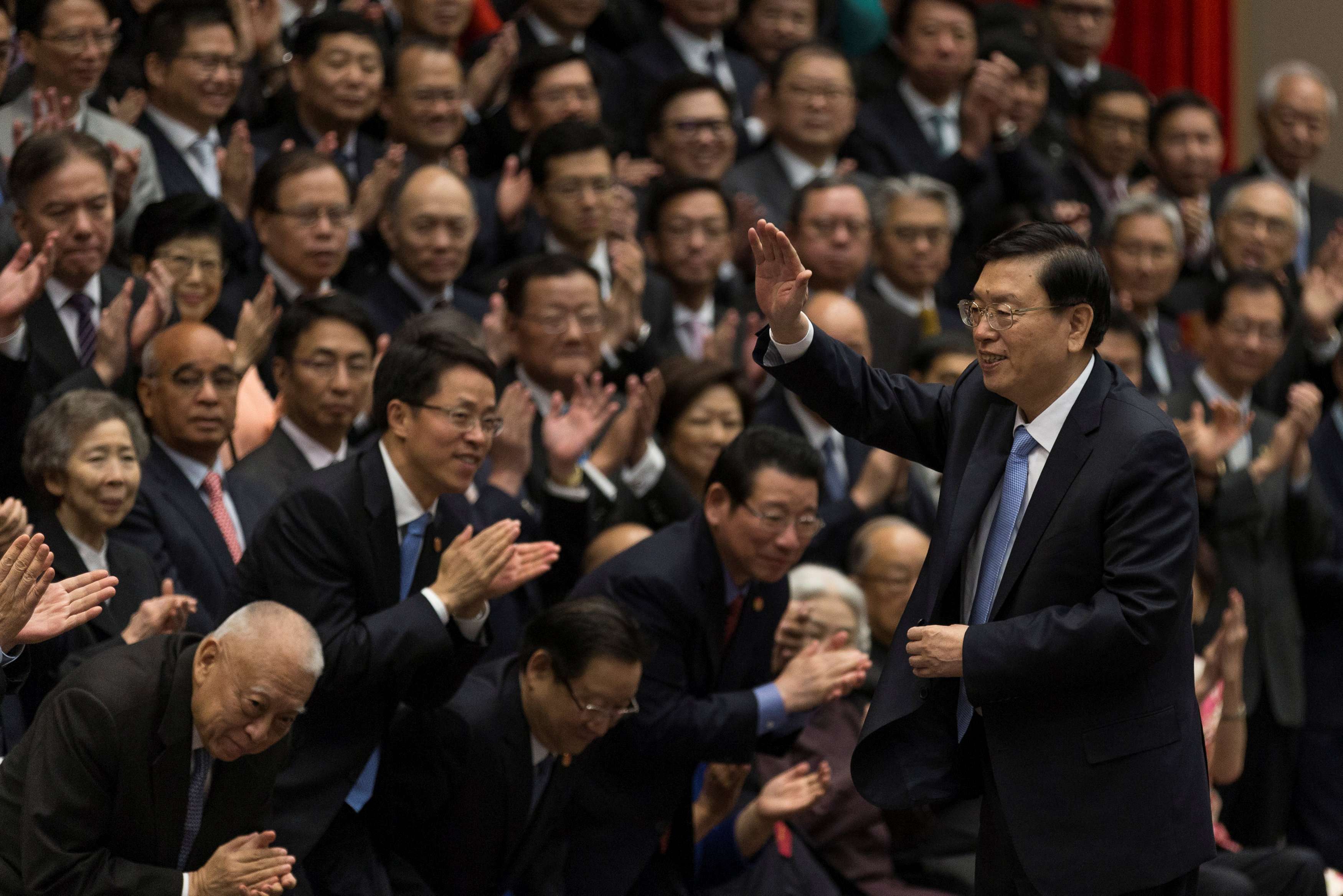 National People’s Congress chairman Zhang Dejiang (right) waves at the end of a meeting with about 220 guests from different sectors of Hong Kong at the central government offices at Tamar. Photo: Reuters