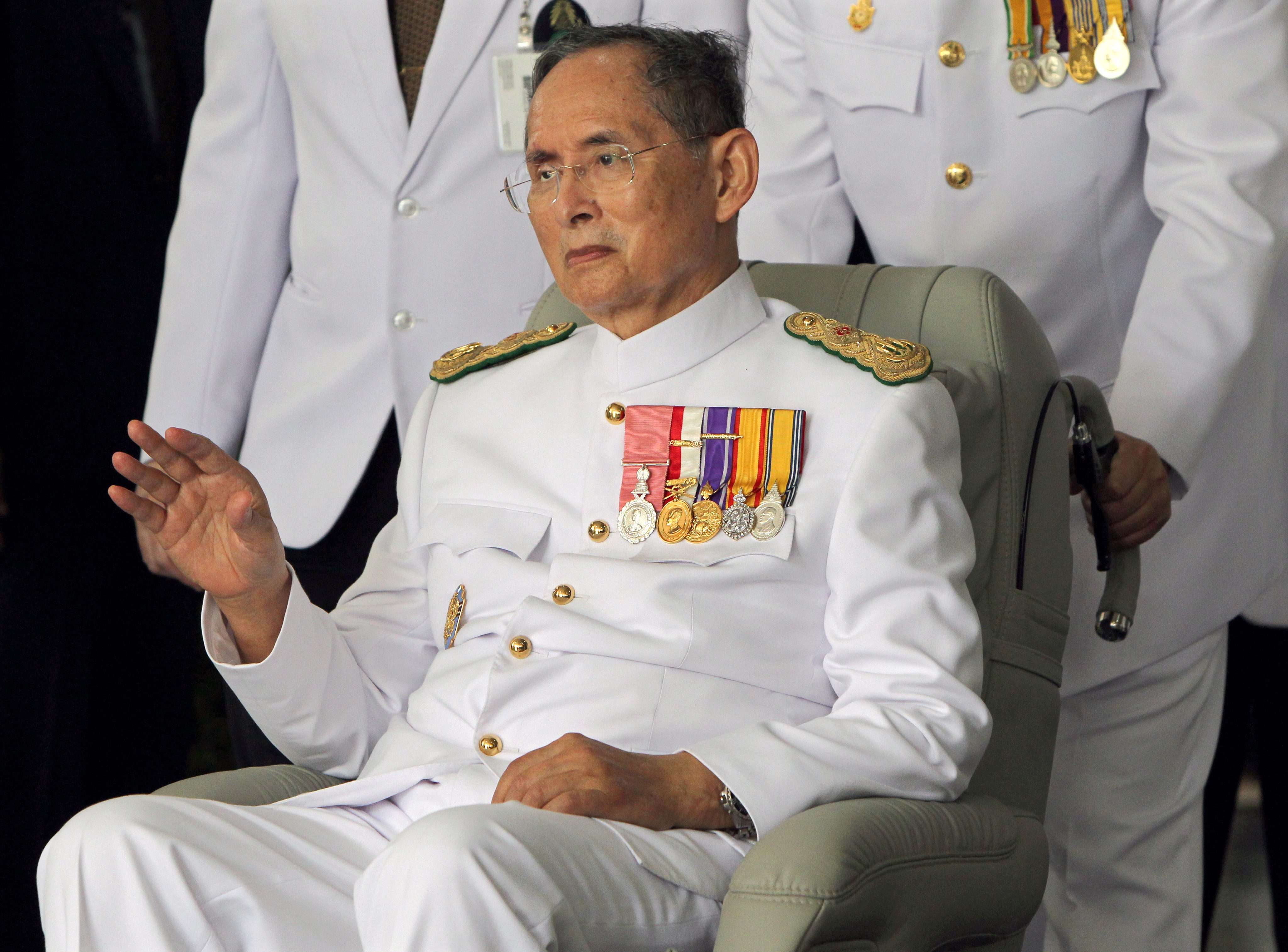 Thai King Bhumibol Adulyadej waves to well-wishers. Photo: EPA