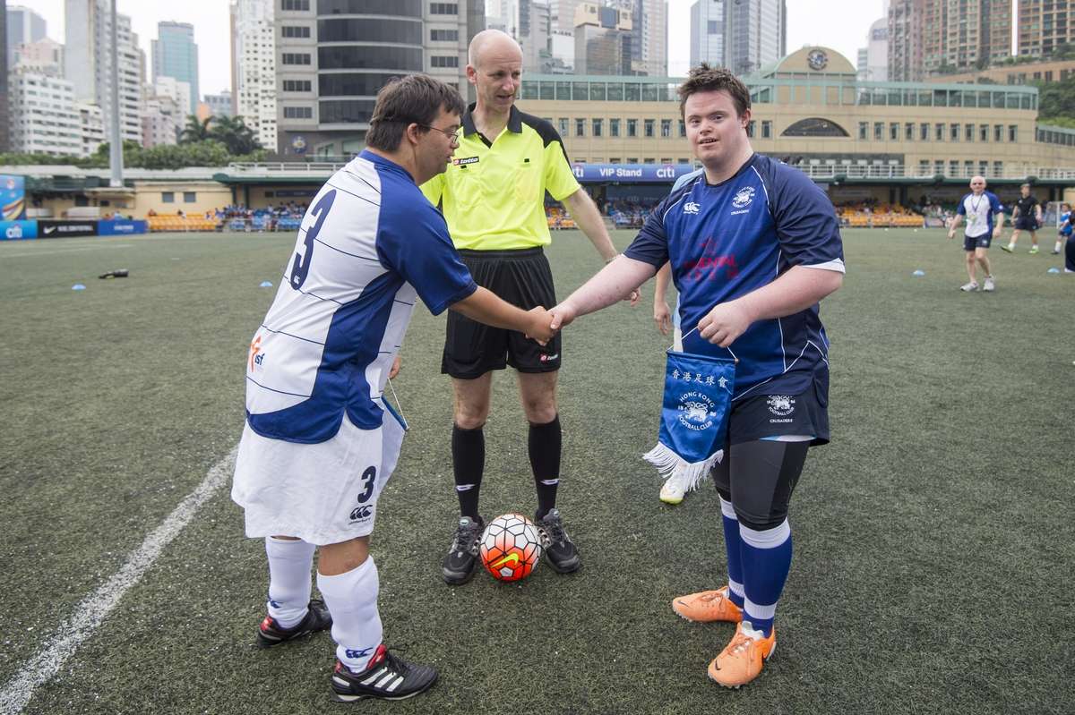 Referee Mike Riley officiates a match between Down’s syndrome children during the HKFC Citi Soccer Sevens on Saturday. Photos: Power Sport Images