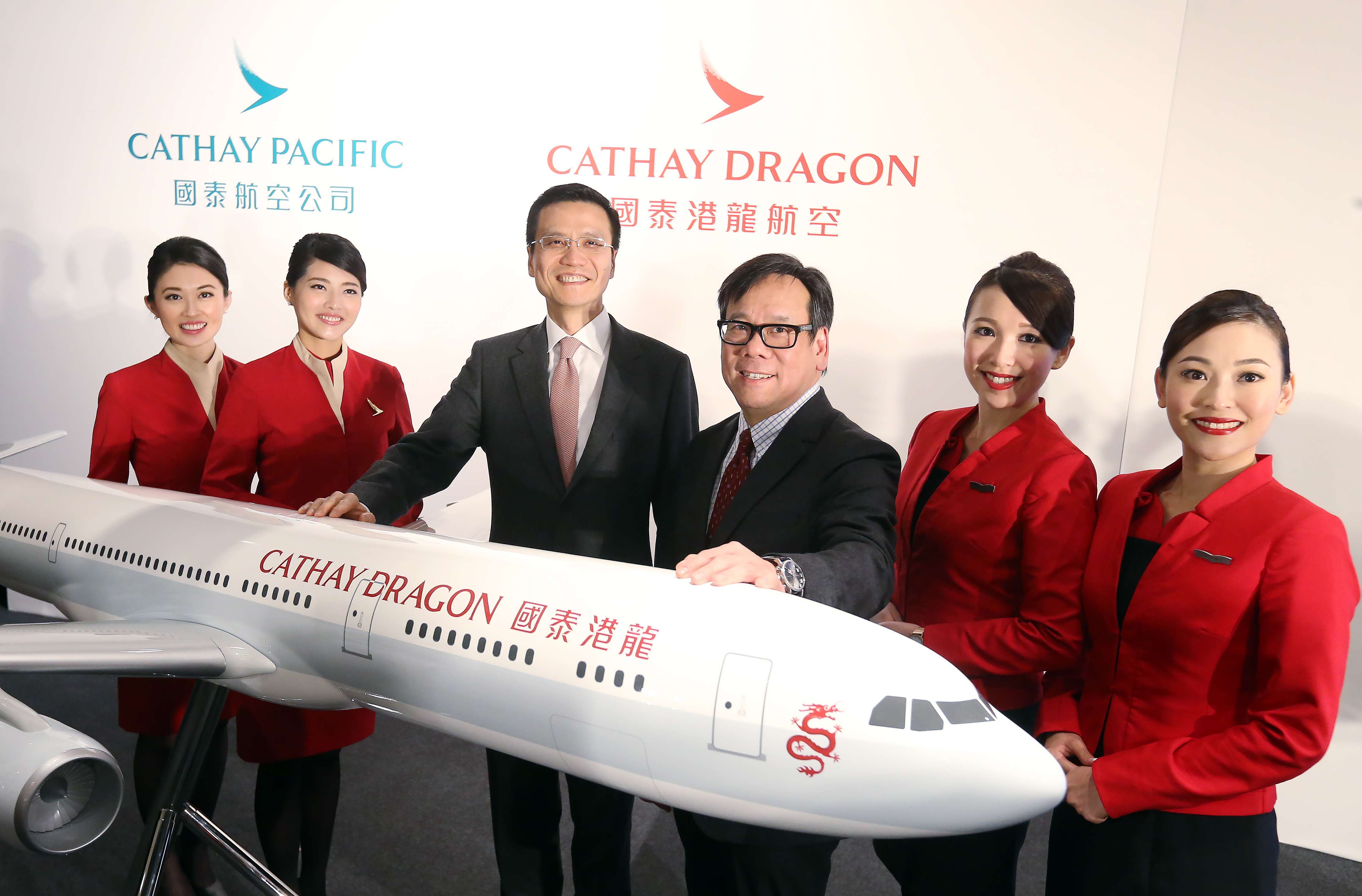 Cathay chief executive Ivan Chu (third from left) posed a picture with Algernon Yau (fourth from left) and other staff members at a press conference on Dragonair’s rebranding in January. Photo: Dickson Lee