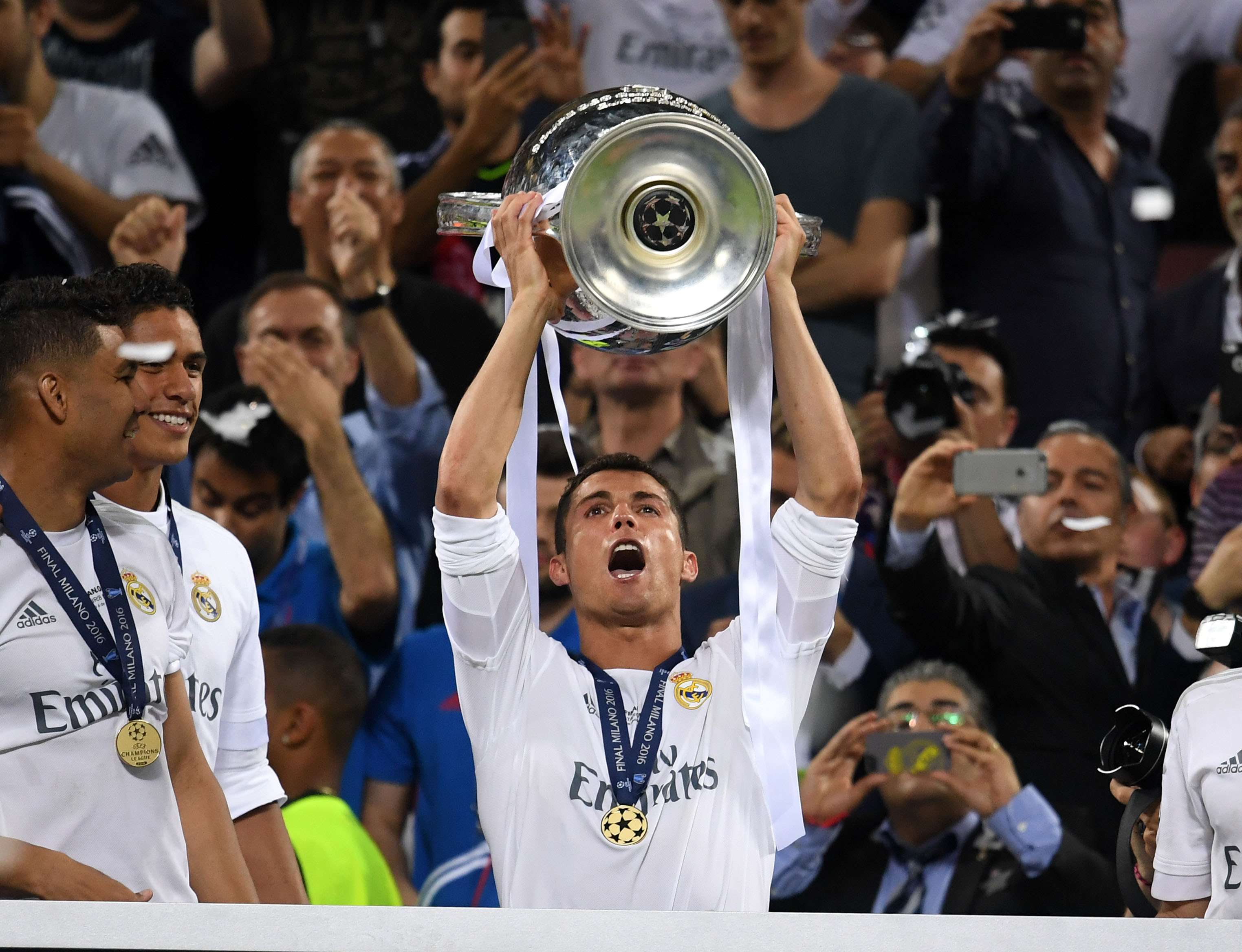Cristiano Ronaldo raises the Champions League trophy as Real Madrid are crowned again. Photo: Xinhua