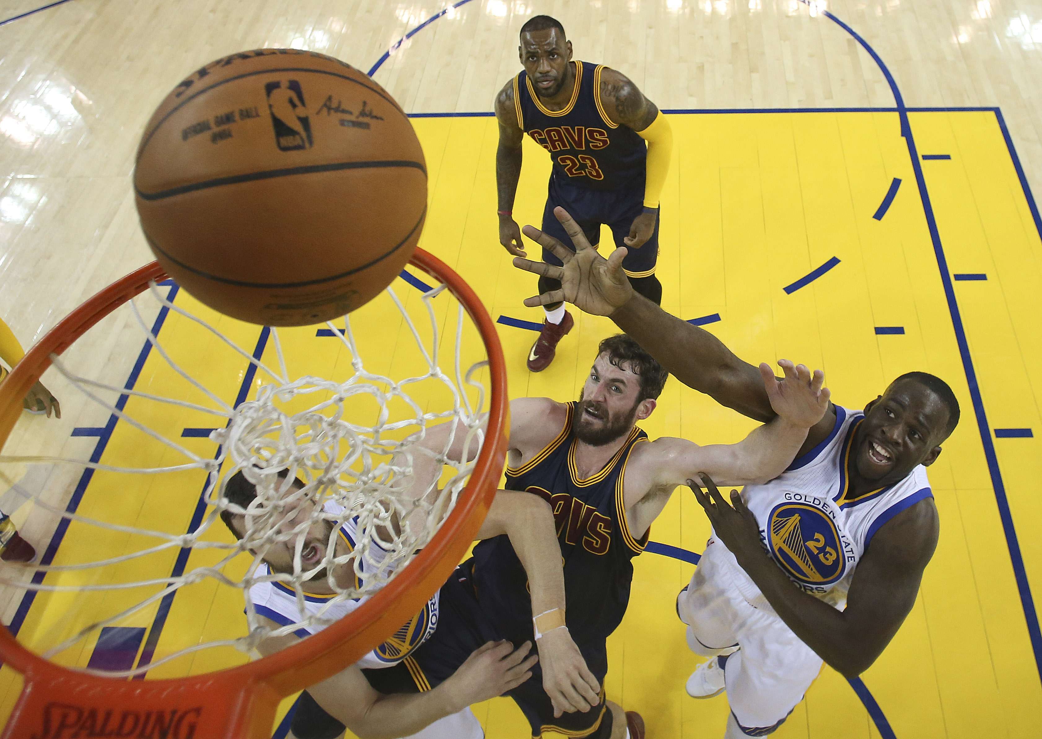 Golden State Warriors forward Draymond Green shoots over Cleveland Cavaliers forward Kevin Love during game one of the NBA Finals. Photo: AP