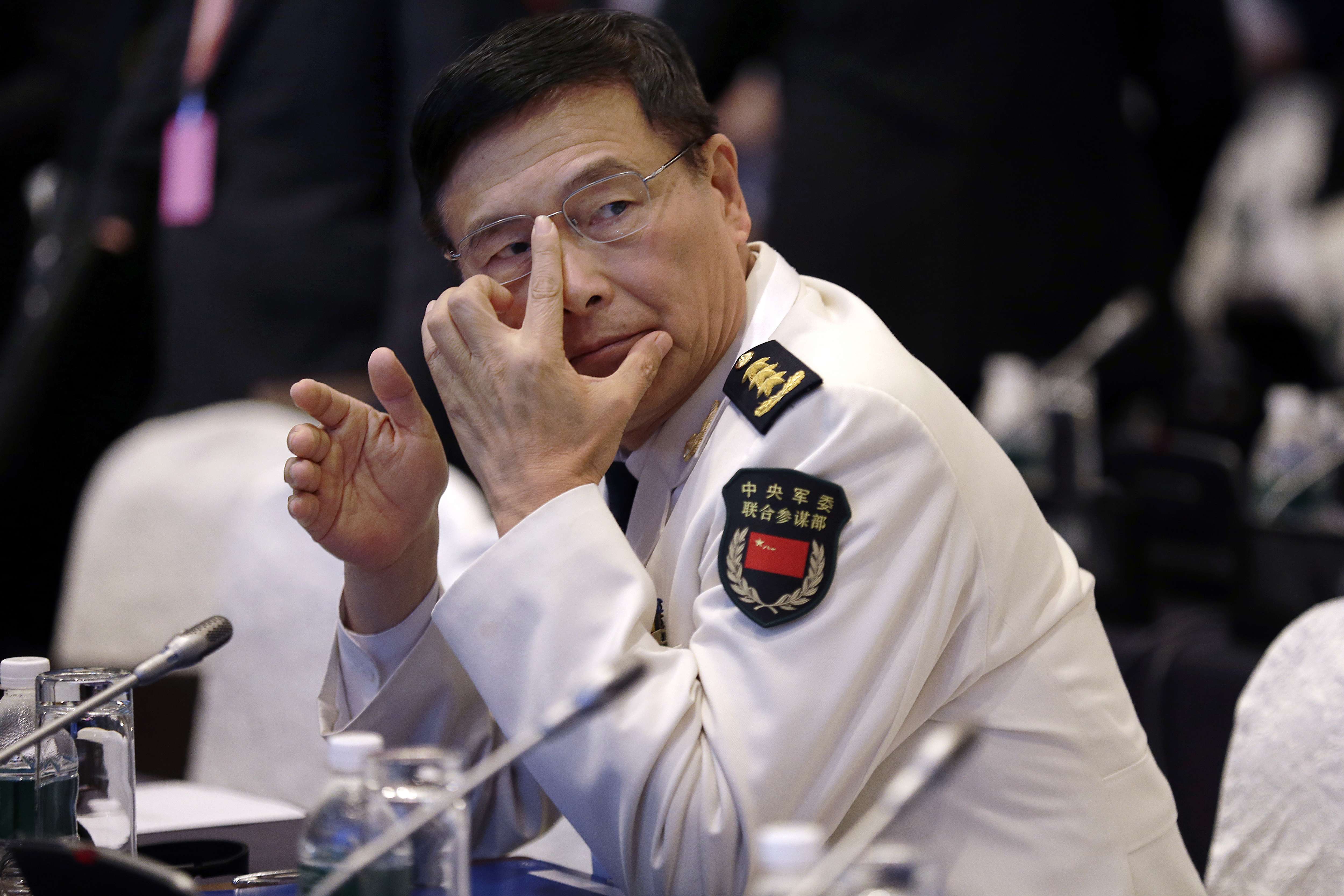 Admiral Sun Jianguo delivered his speech in a booming, shrill tone that seemed designed to intimidate the audience. Photo: AP