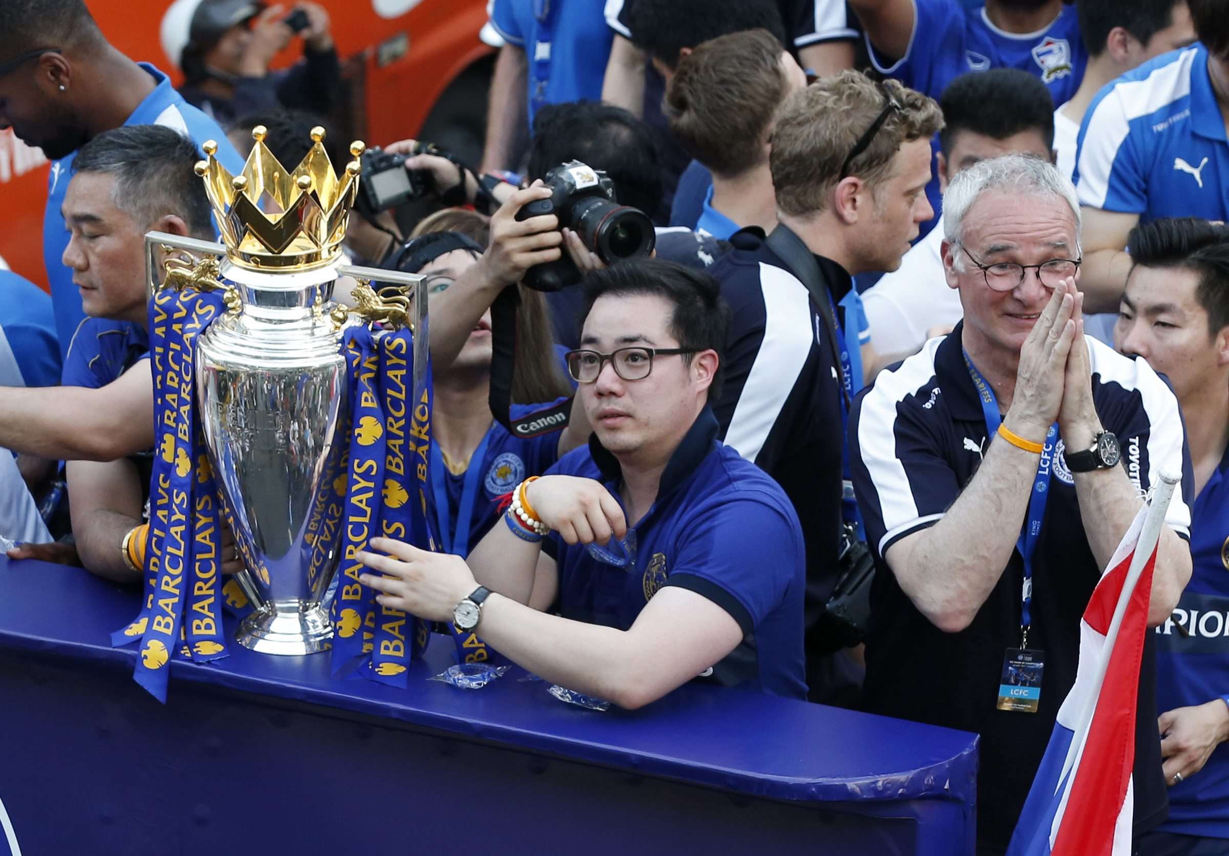 Leicester City chairman Vichai Srivaddhanaprabha (left) and vice chairman Aiyawatt Srivaddhanaprabha parade the Premier League title with manager Claudio Ranieri in a rare example of a successful Asian ownership model in the EPL. Photo: EPA