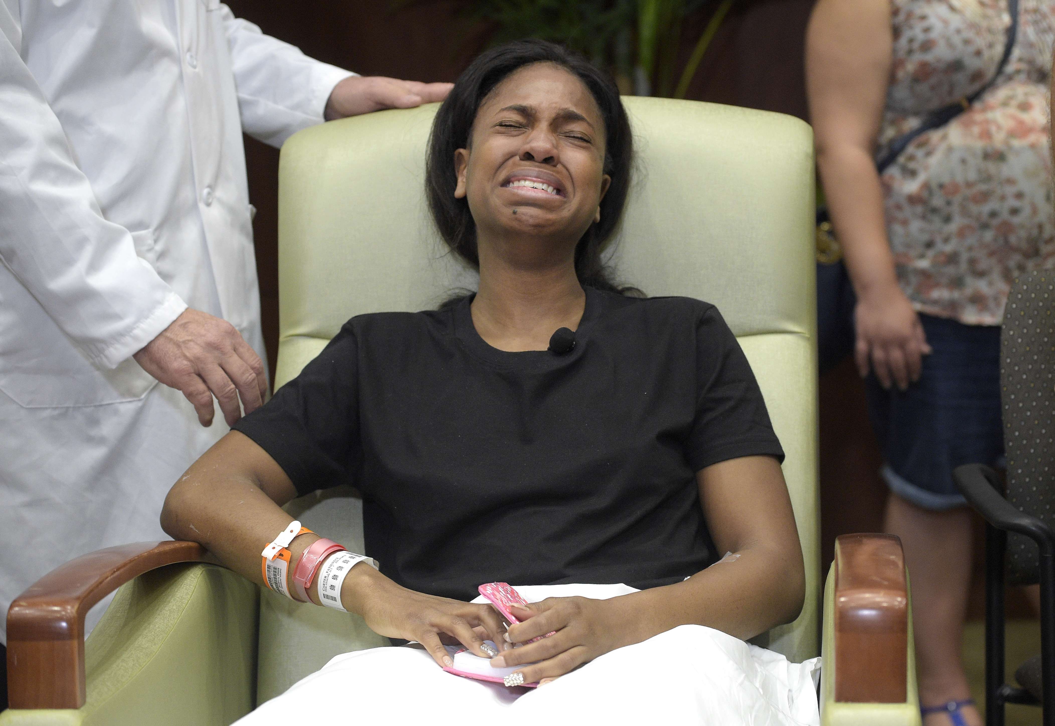 Patience Carter, a survivor of the Pulse nightclub shooting, sobs after telling her story during a news conference at Florida Hospital Orlando on Tuesday. Photo: AP