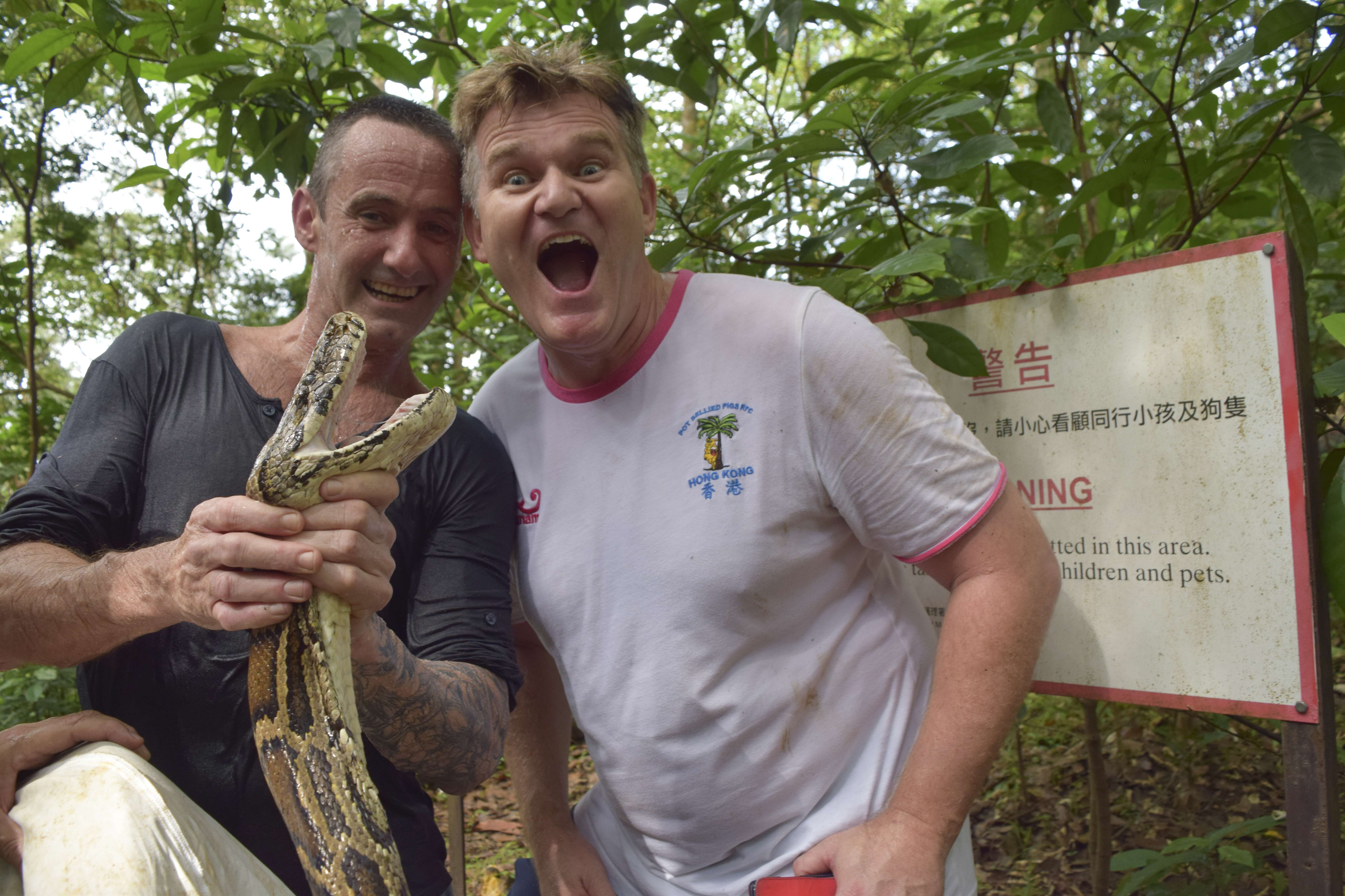 Karl Davies felt able to relax after Dave Willott (left) caught the Burmese python which had sunk its teeth into Davies’ leg two days earlier and tried to grip the 107kg Hong Kong resident in its coils. Photos: Red Door News