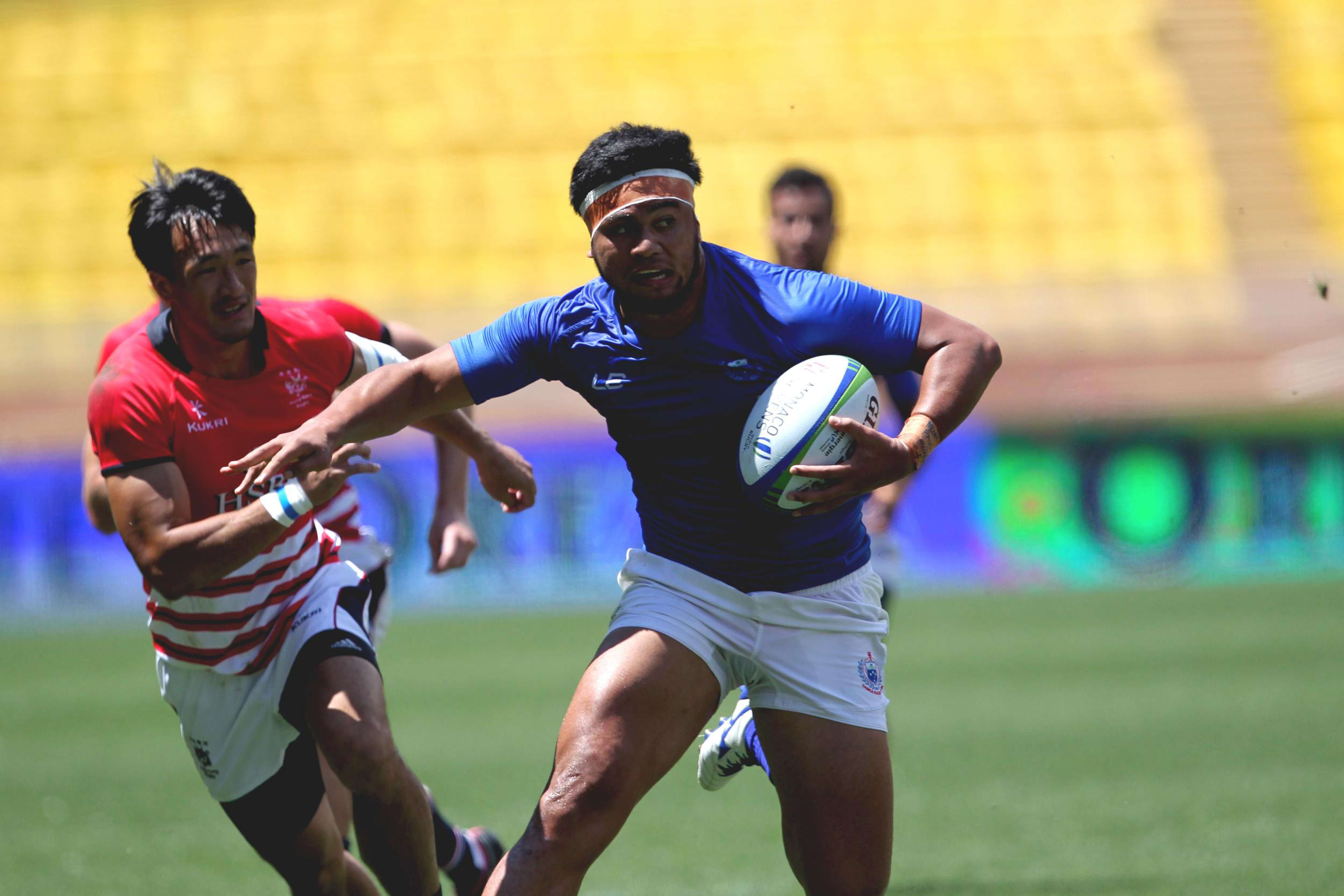 Hong Kong’s Salom Yiu Kam-shing (left) chases Belgium Tuatagaloa of Samoa during the Olympic repêchage sevens qualifier quarter-finals in Monaco on Sunday. Photos: World Rugby