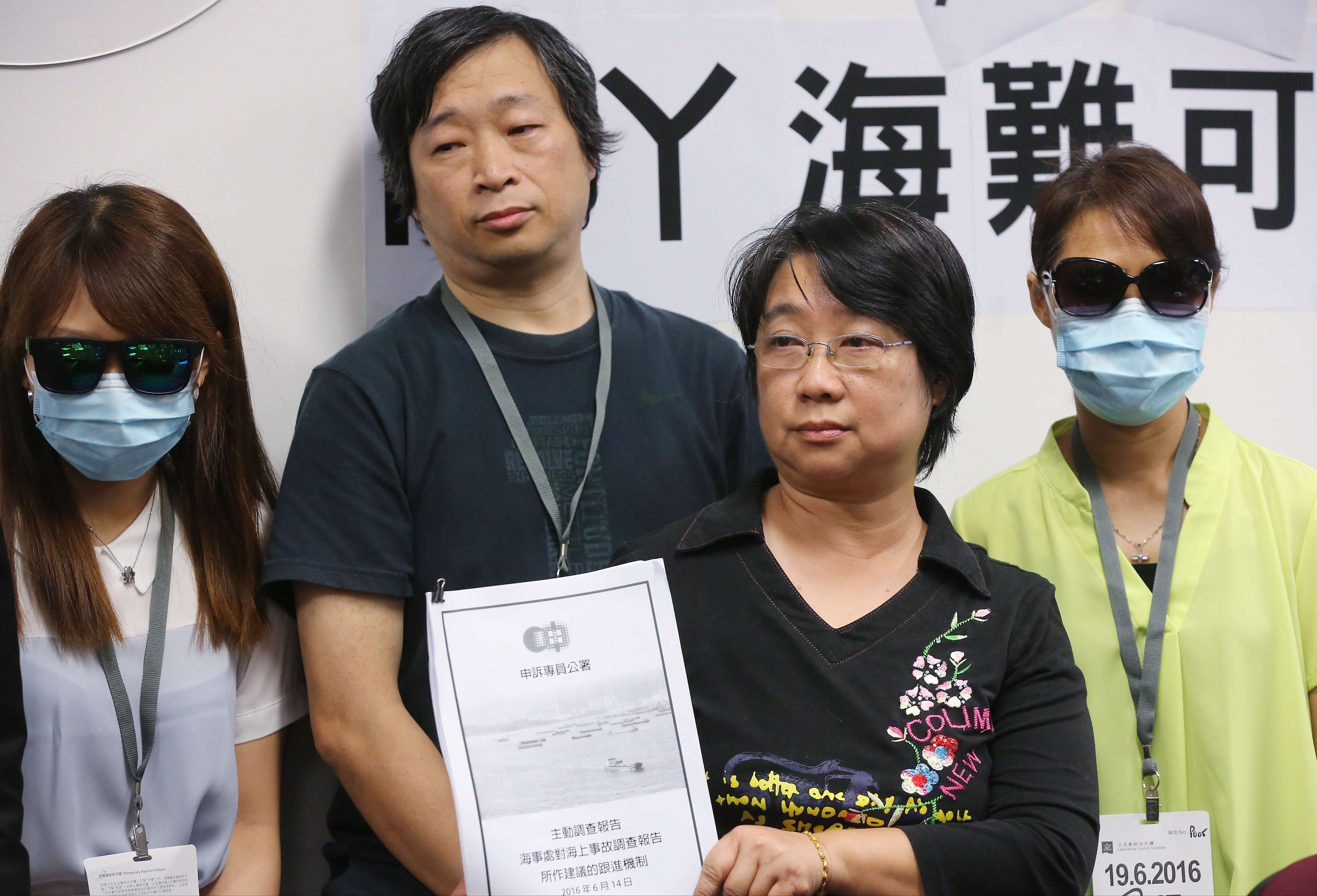 Families of victims in the Lamma ferry tragedy including Irene Koo (second from right) at Legco on Sunday. Photo: Edward Wong