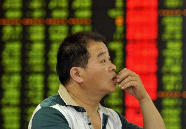 A file picture of a retail investor in Fuyang in Anhui province monitoring stock prices. Photo: Reuters