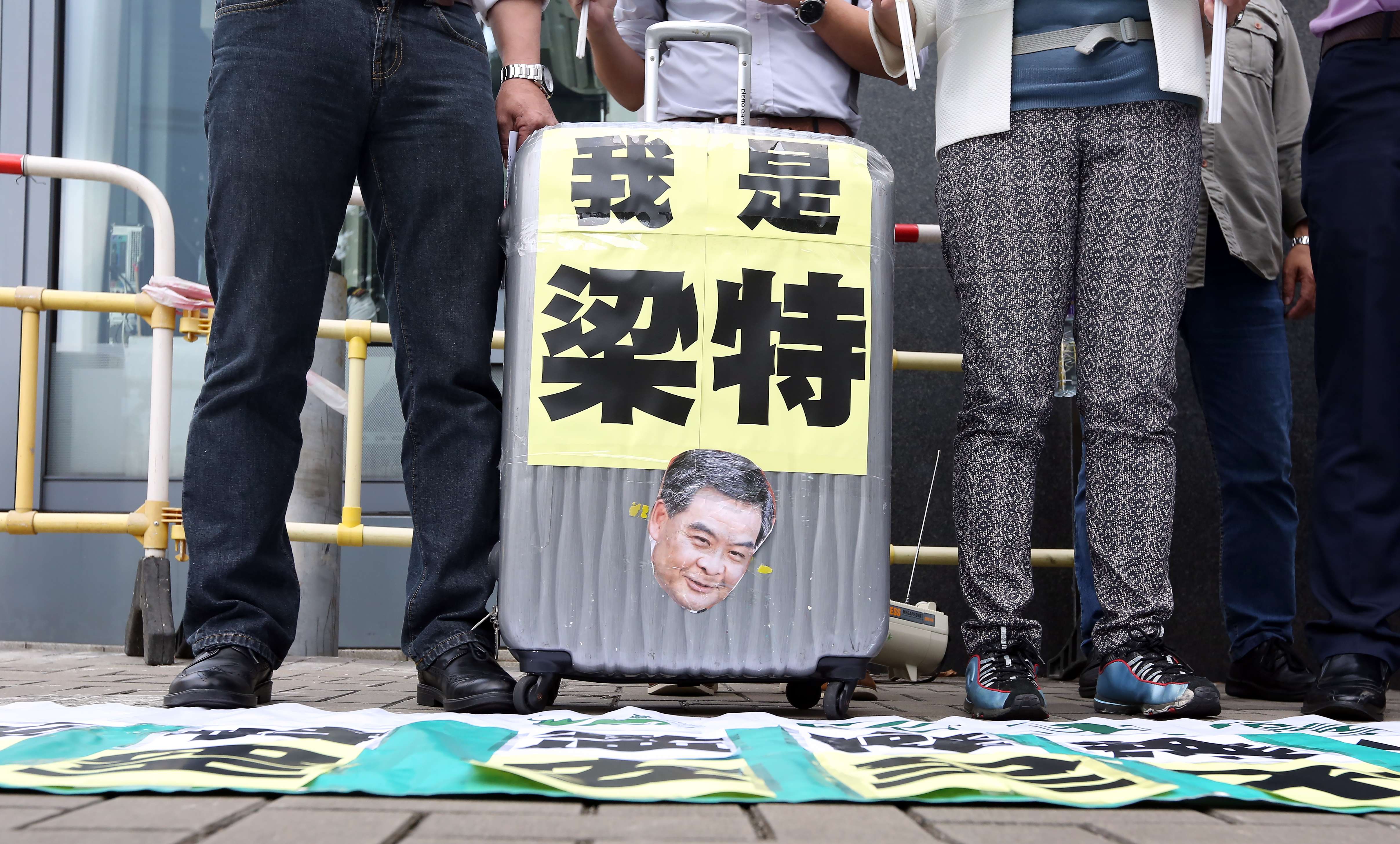 Members of Democratic Party staged a protest outside the Central Government Office in April against CY Leung allegedly pressuring airport staff in bag row . Photo: Nora Tam