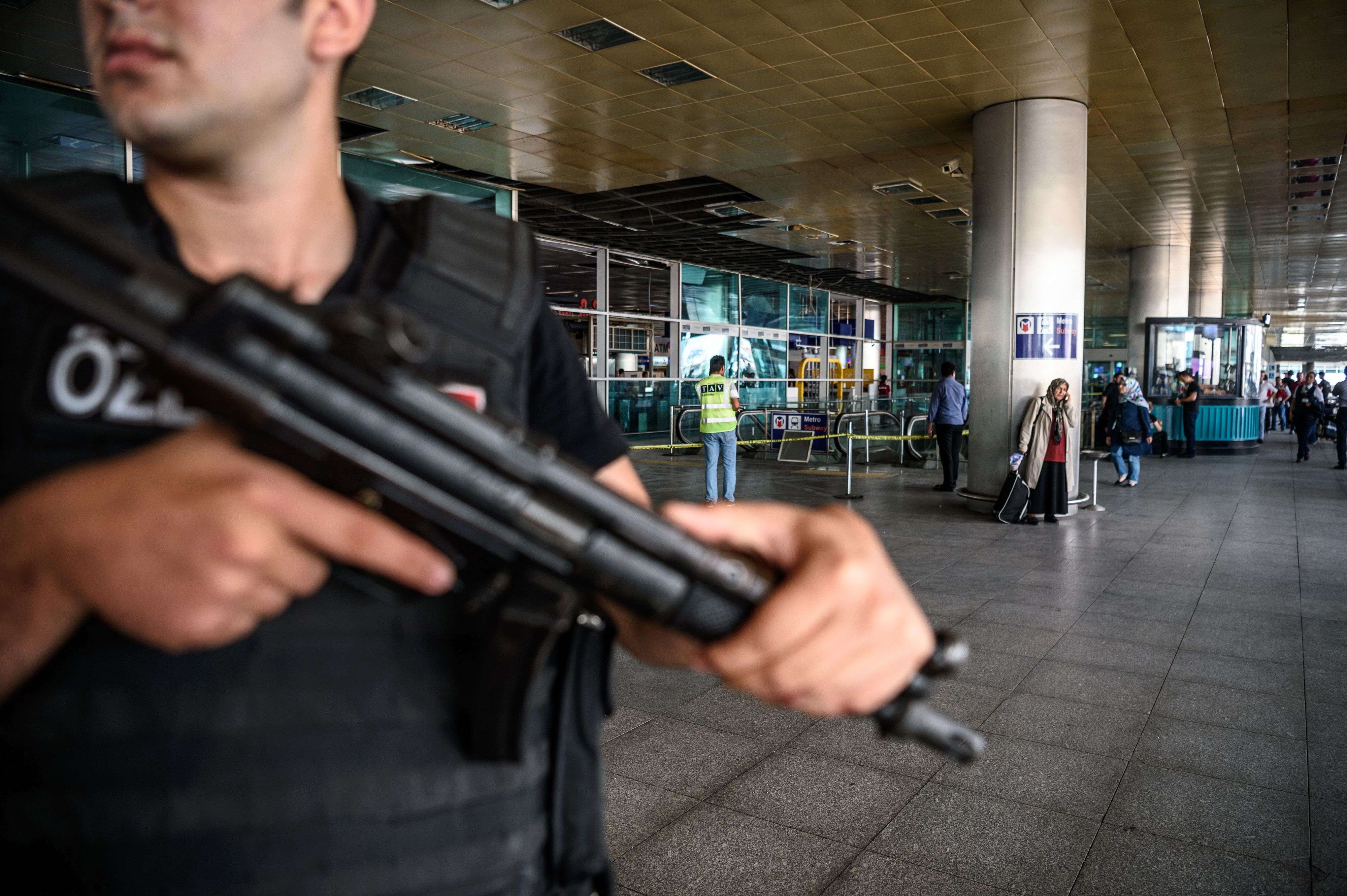 A Turkish anti-riot police officer stands guard at Ataturk airport’s international arrival terminal in Istanbul, a day after a suicide bombing and gun attack killed at least 41 people. Photo: AFP