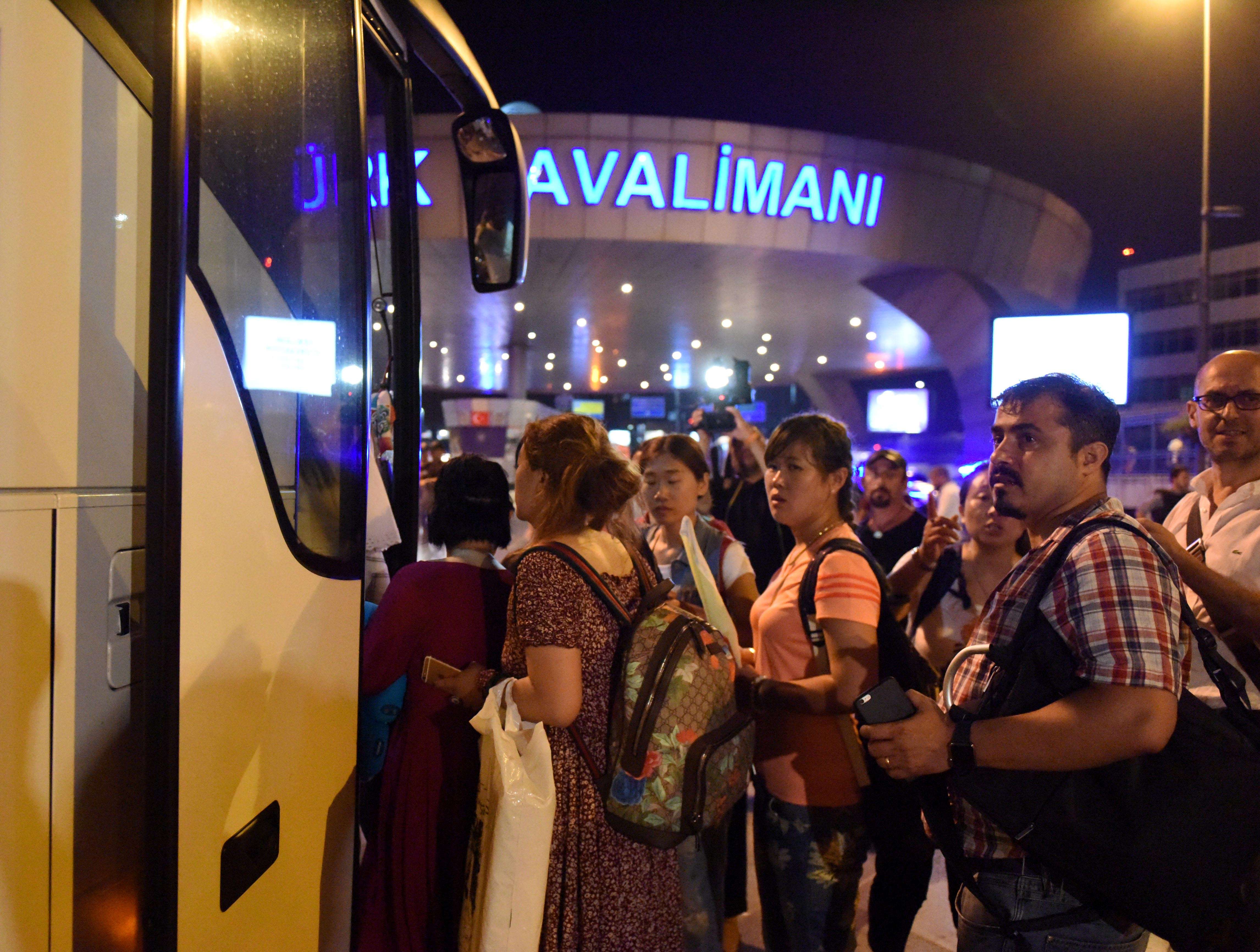 Stranded passengers are transferred to nearby hotels from Ataturk International Airport in Istanbul, Turkey, after suicide attacks . Photo: Xinhua