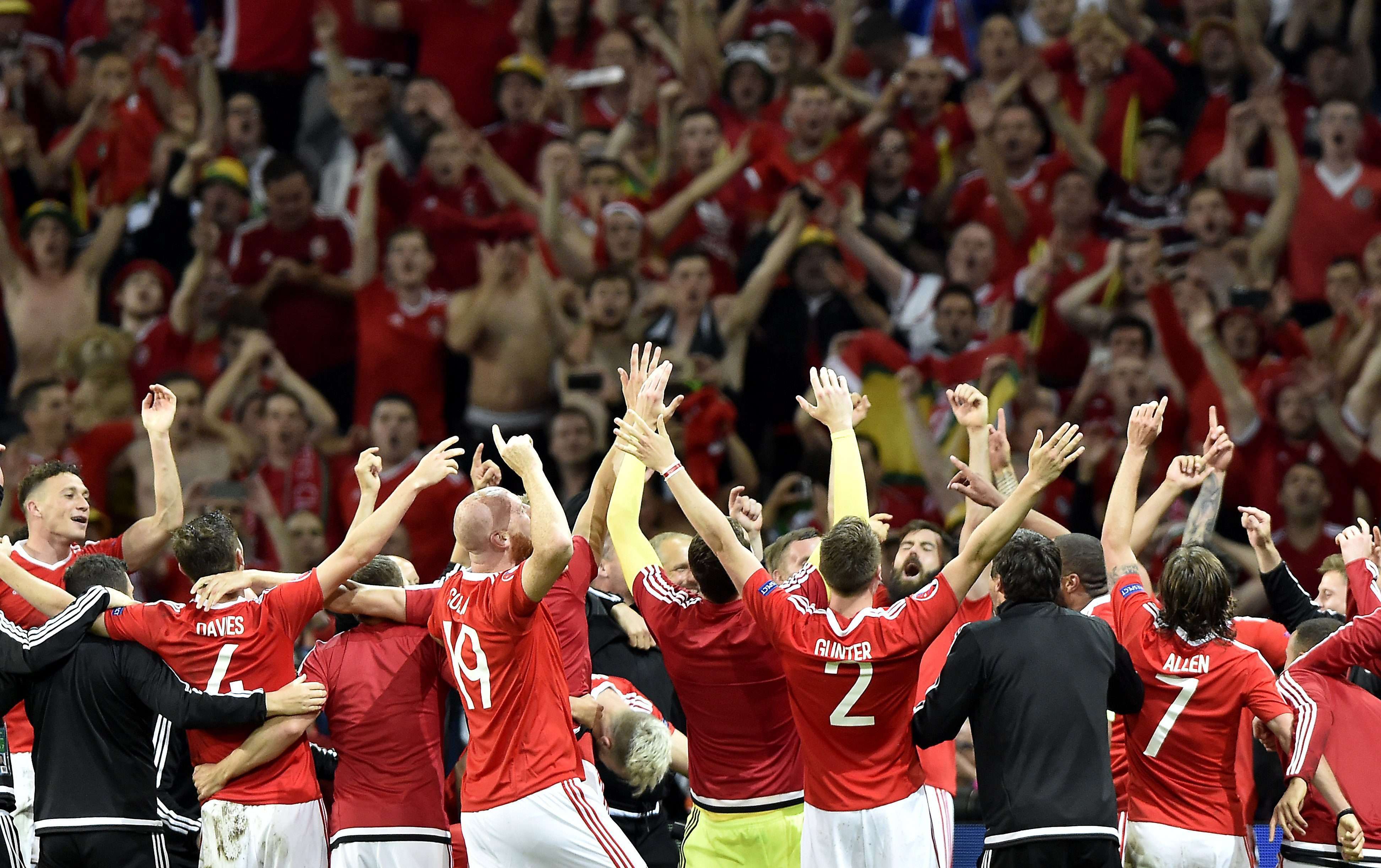Wales celebrate with fans after the 3-1 win over Belgium. Photo: EPA