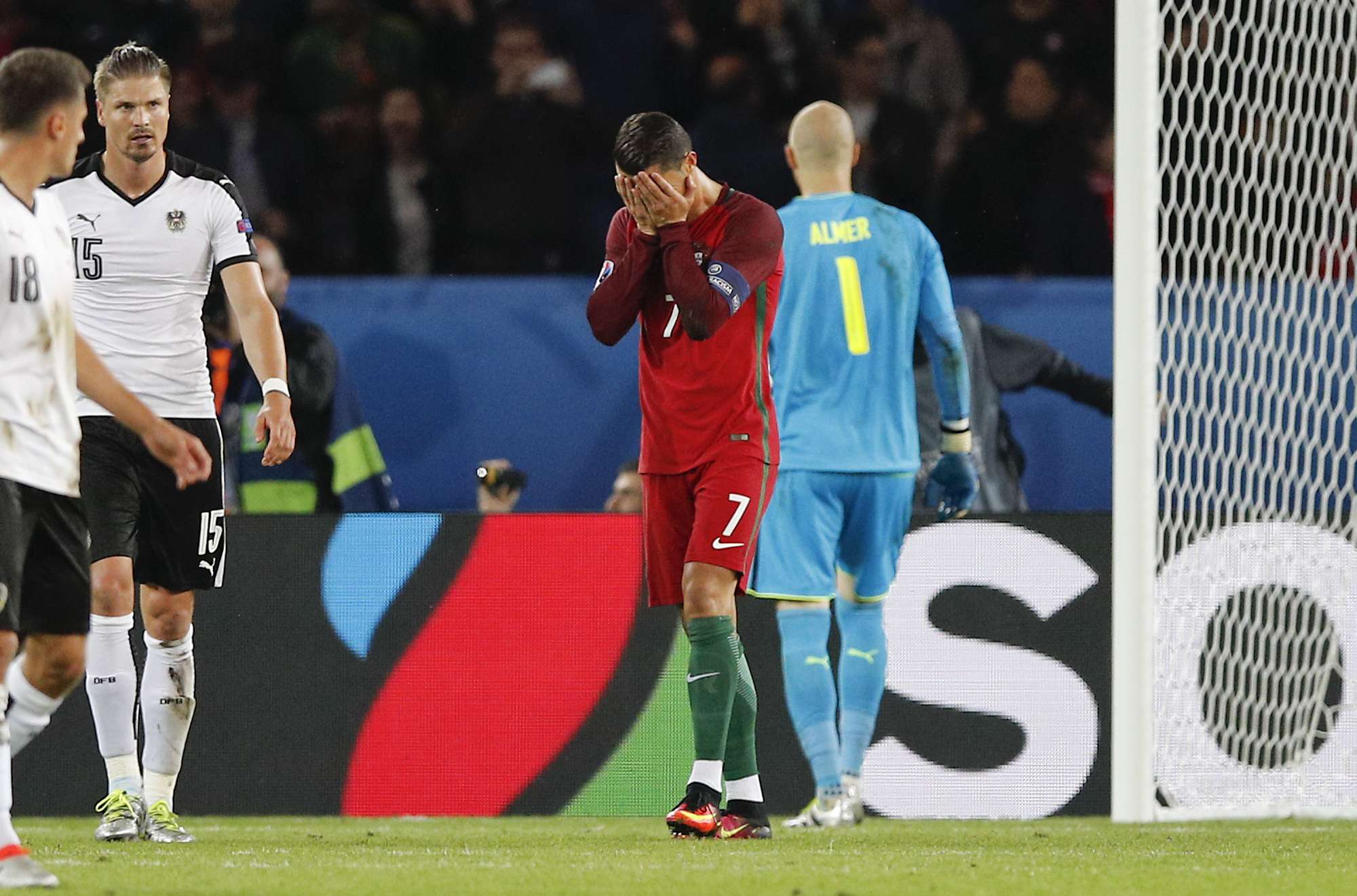 Portugal's Cristiano Ronaldo (centre) covers his face after missing a penalty during his nation’s draw in a group match with Austria at Euro 2016. Photo: AP