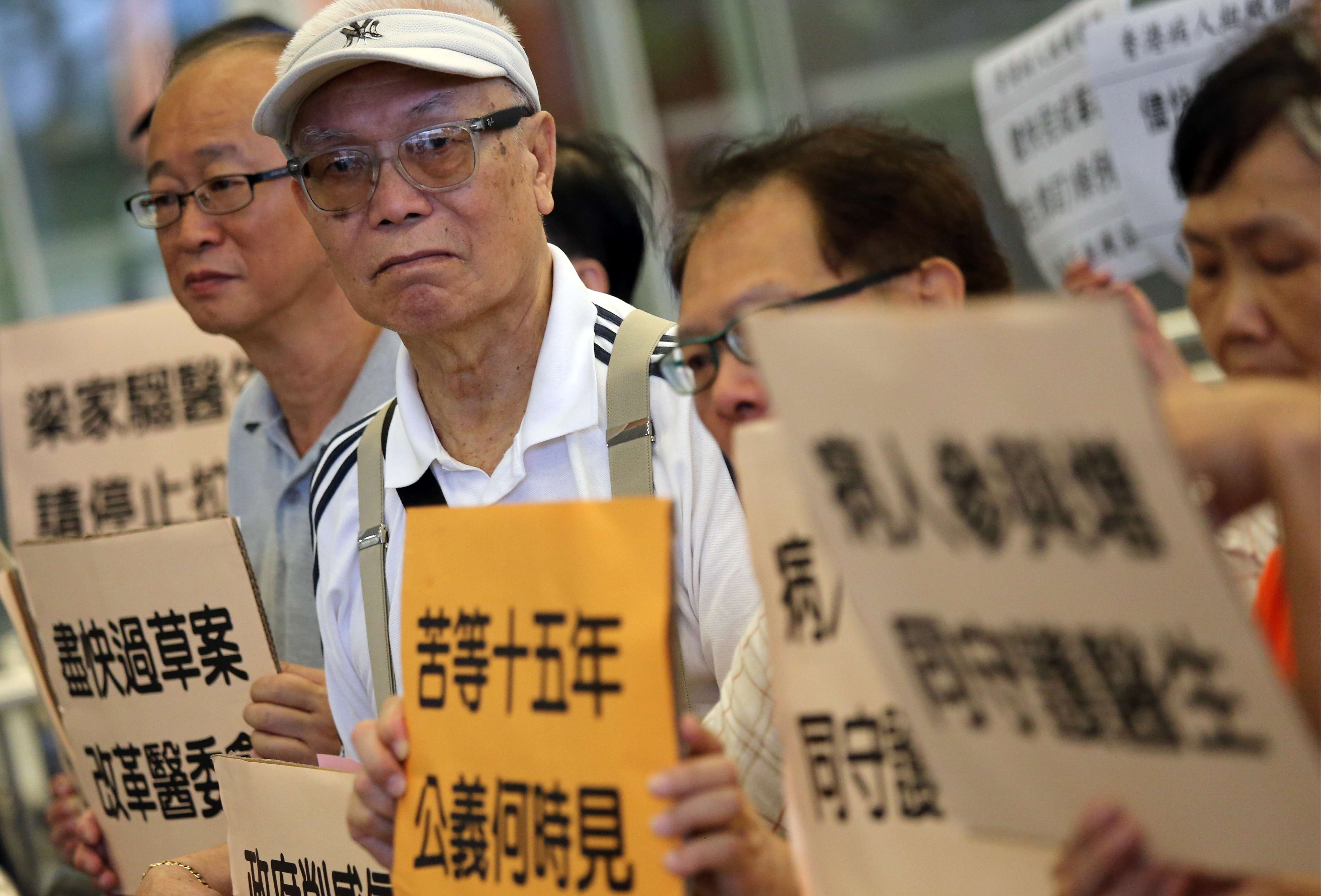 Hongkongers rally outside the Legislative Council building calling for the medical reform bill to be passed. Photo: Dickson Lee
