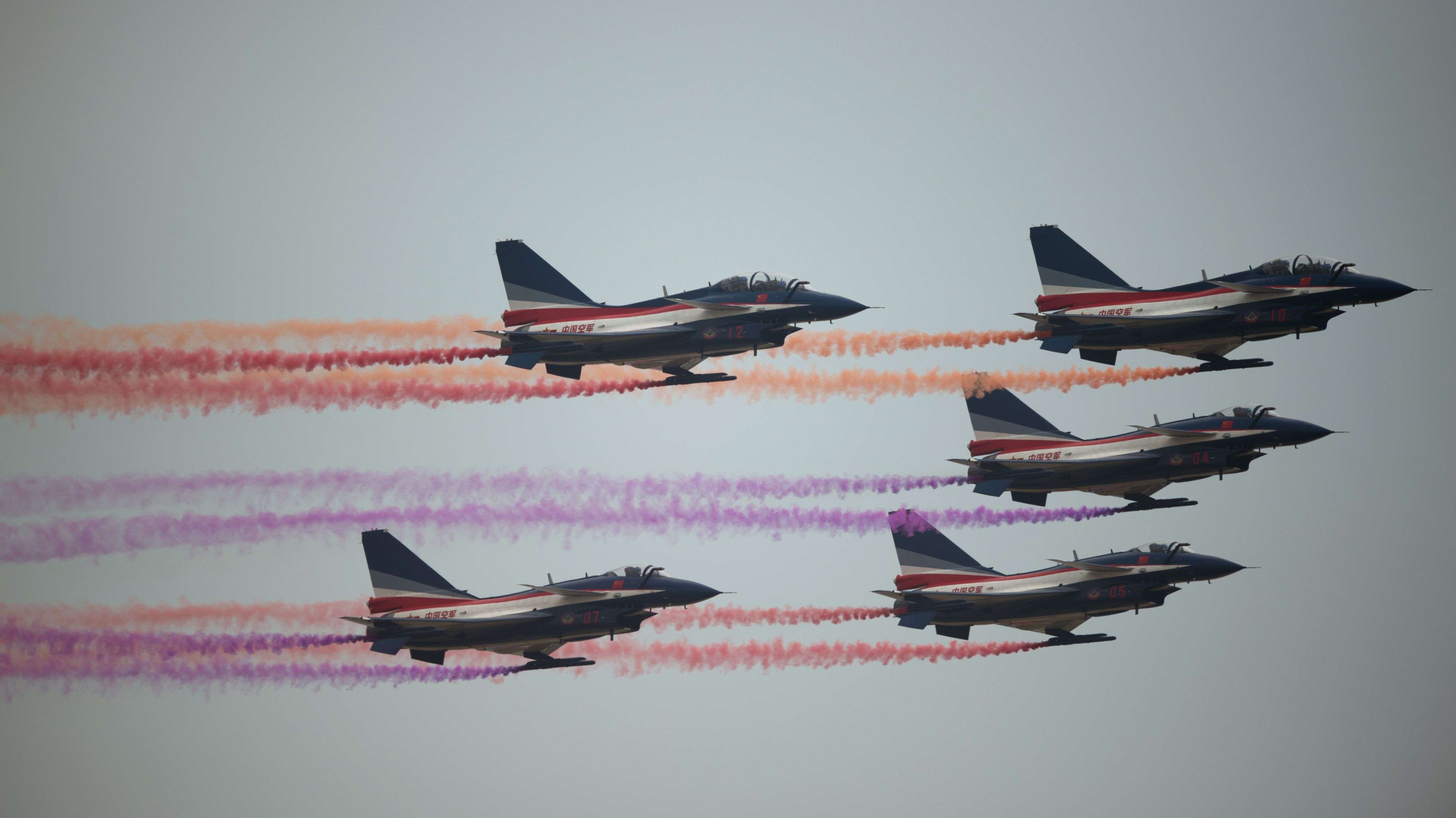 J-10 fighter jets of the Bayi Aerobatic Team of the People’s Liberation Army's Air Force perform at the Airshow China 2014. Photo: Johanne Eisele.