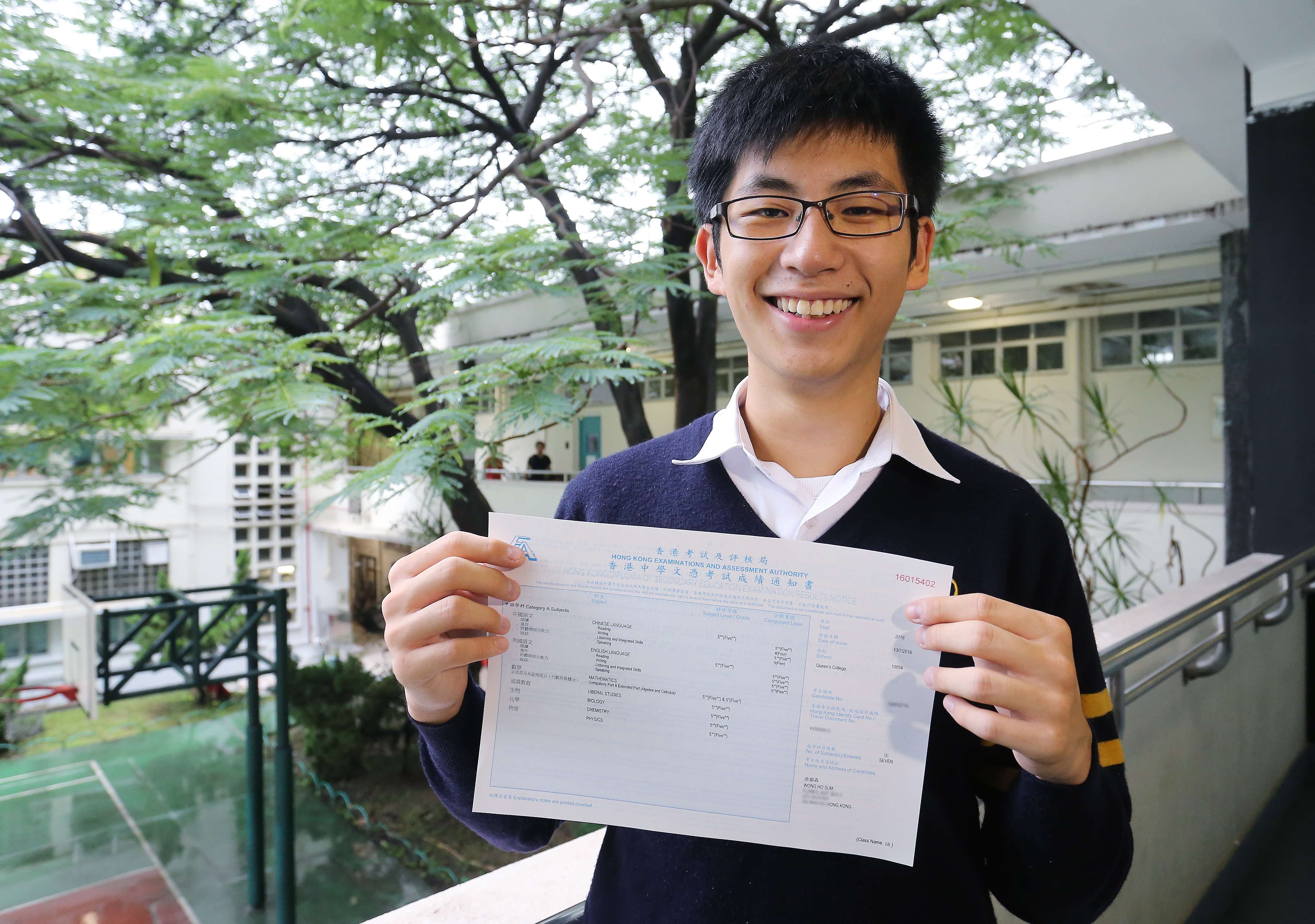 Proud student Wong Ho-sum, from Queen’s College in Causeway Bay, with his Diploma of Secondary Education exam results. Photo: Dickson Lee