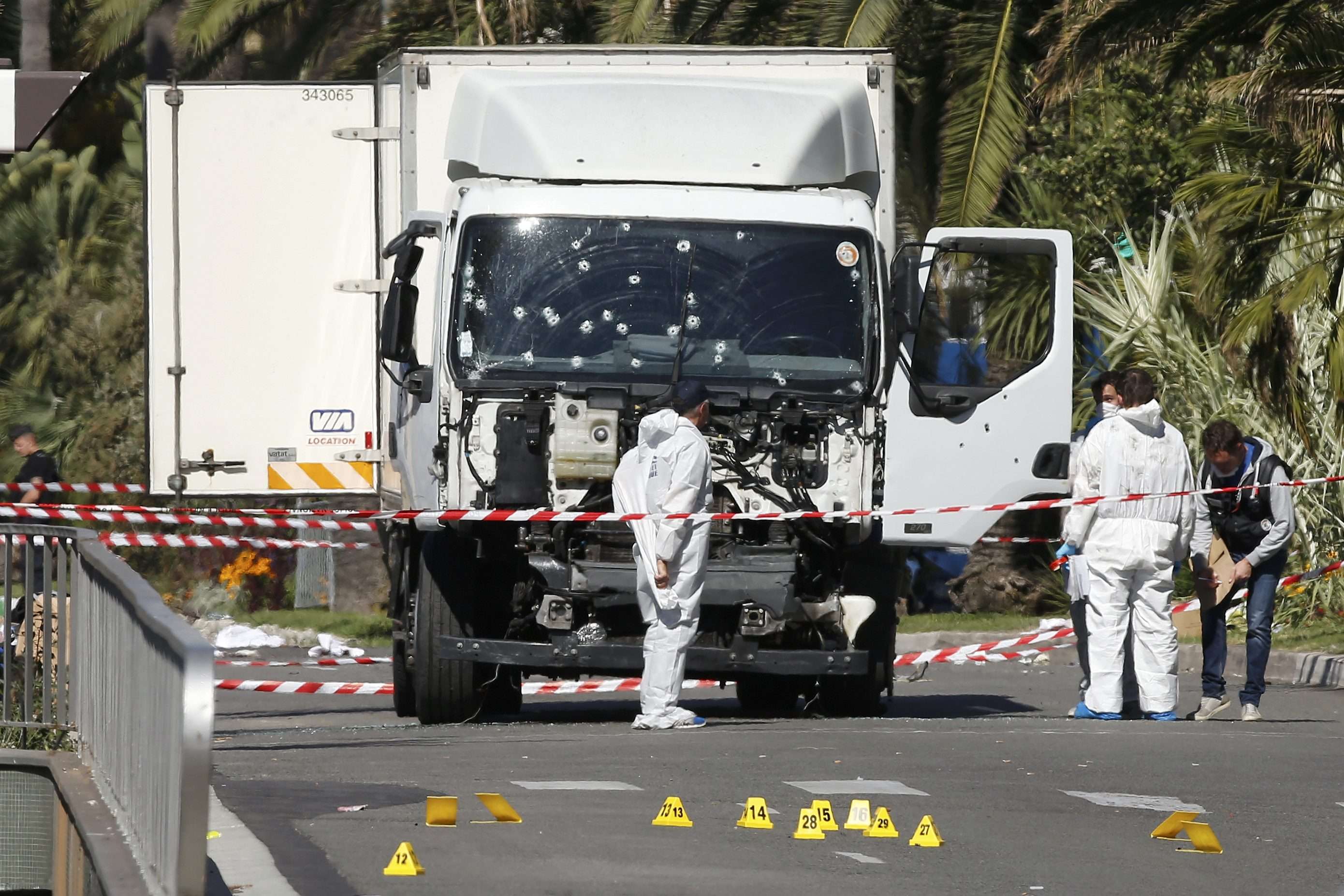 Police officers work near the truck that mowed through revellers in Nice. Photo: Reuters