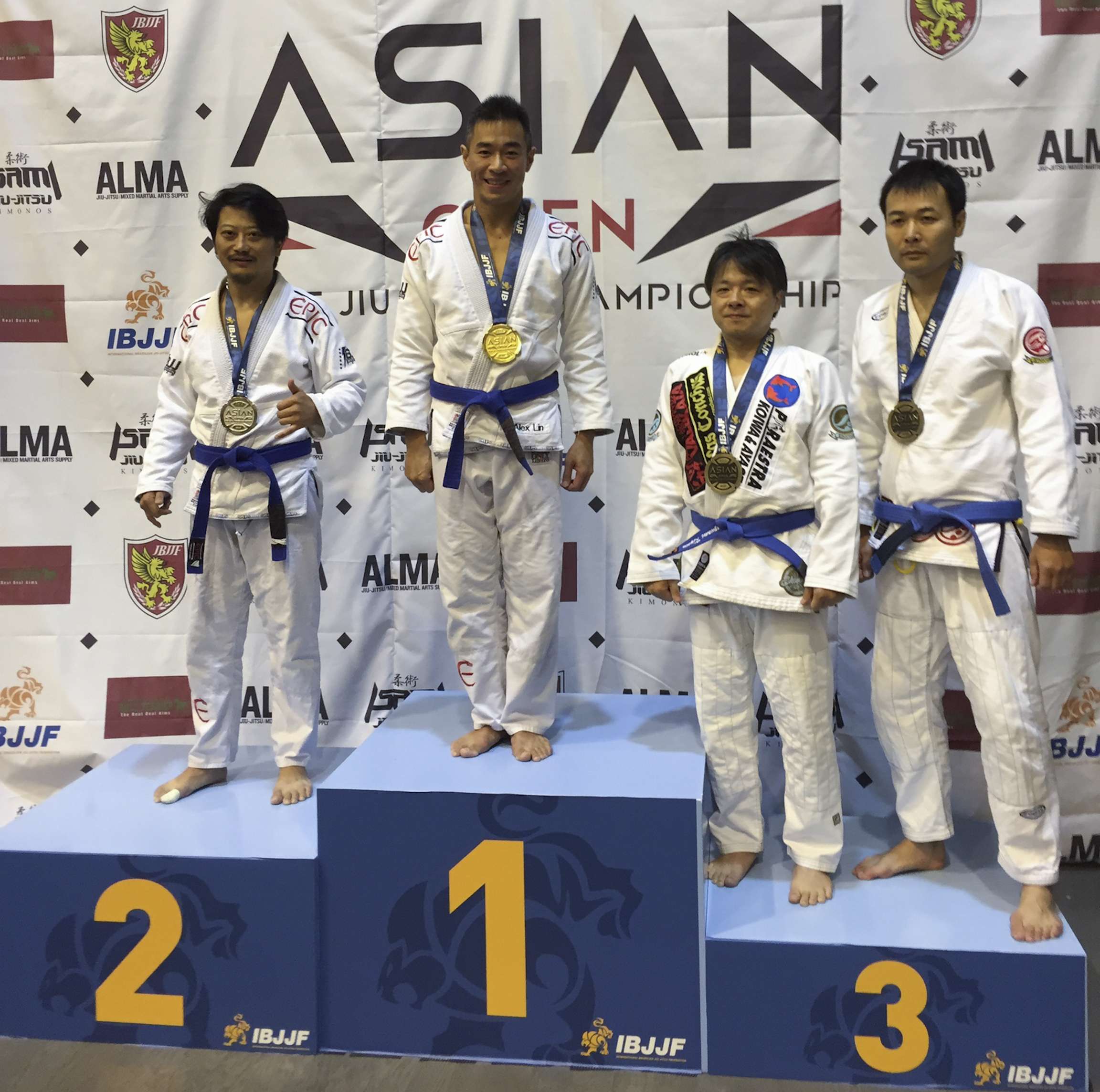 Alex Lin (second from left) on the podium at the IBJJF Asian Open Tokyo in 2015.