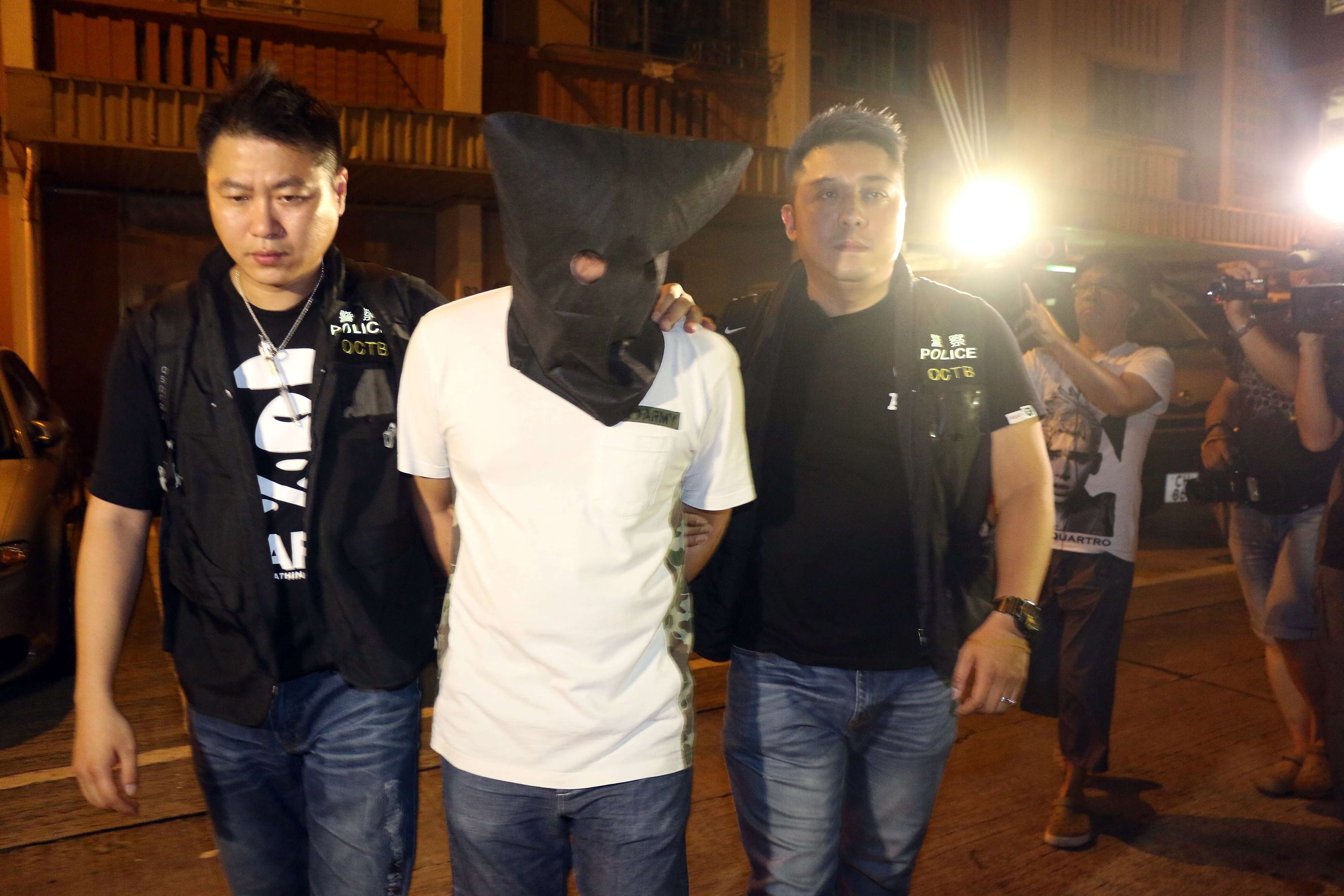 Police arrested a man for illegal bookmaking and seized a total of HK$350 million worth of betting slips in Ping Shek Estate. Photo: SCMP Pictures