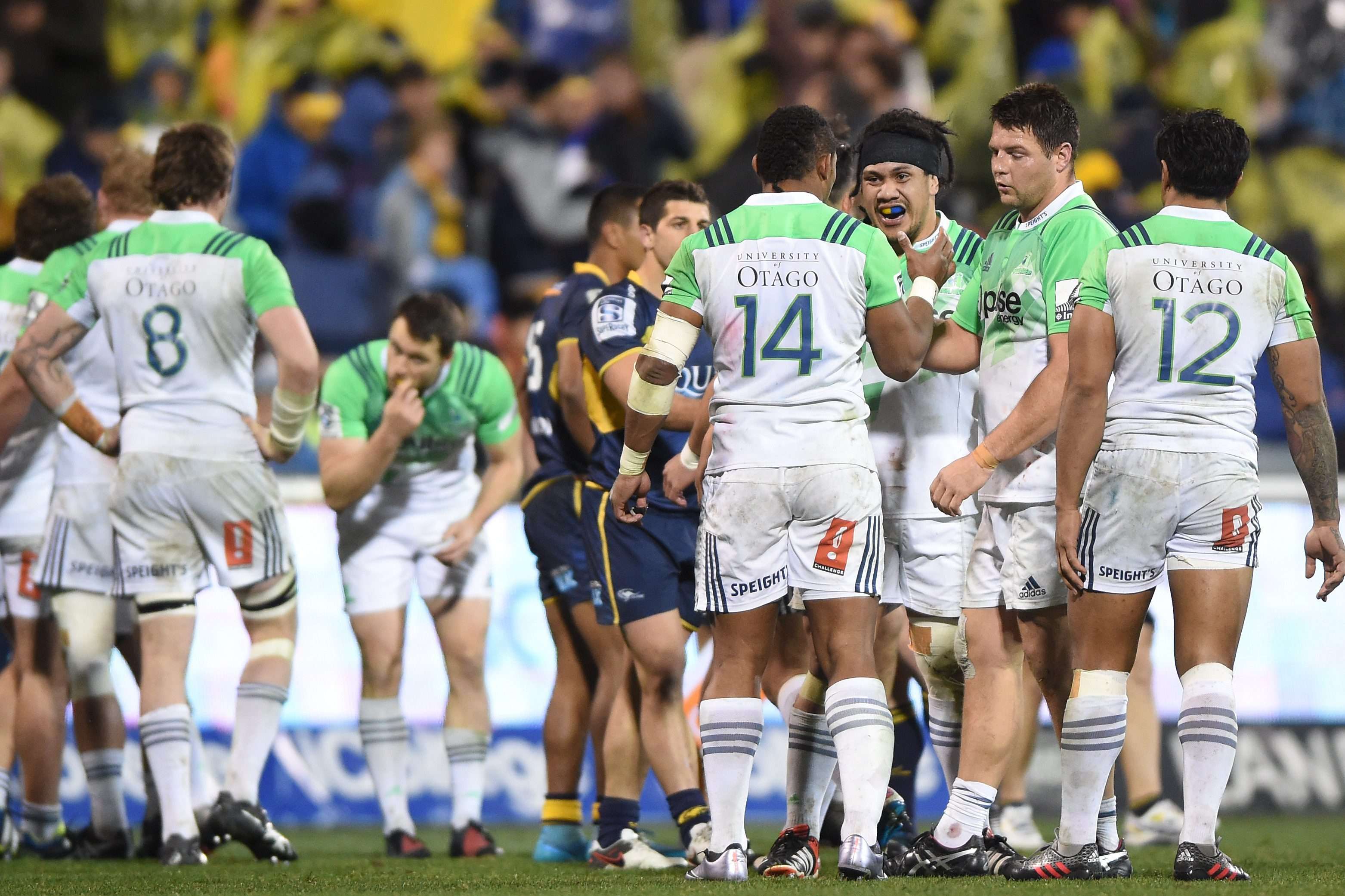 The Highlanders celebrate their win over the Brumbies on Firday. Photos: EPA