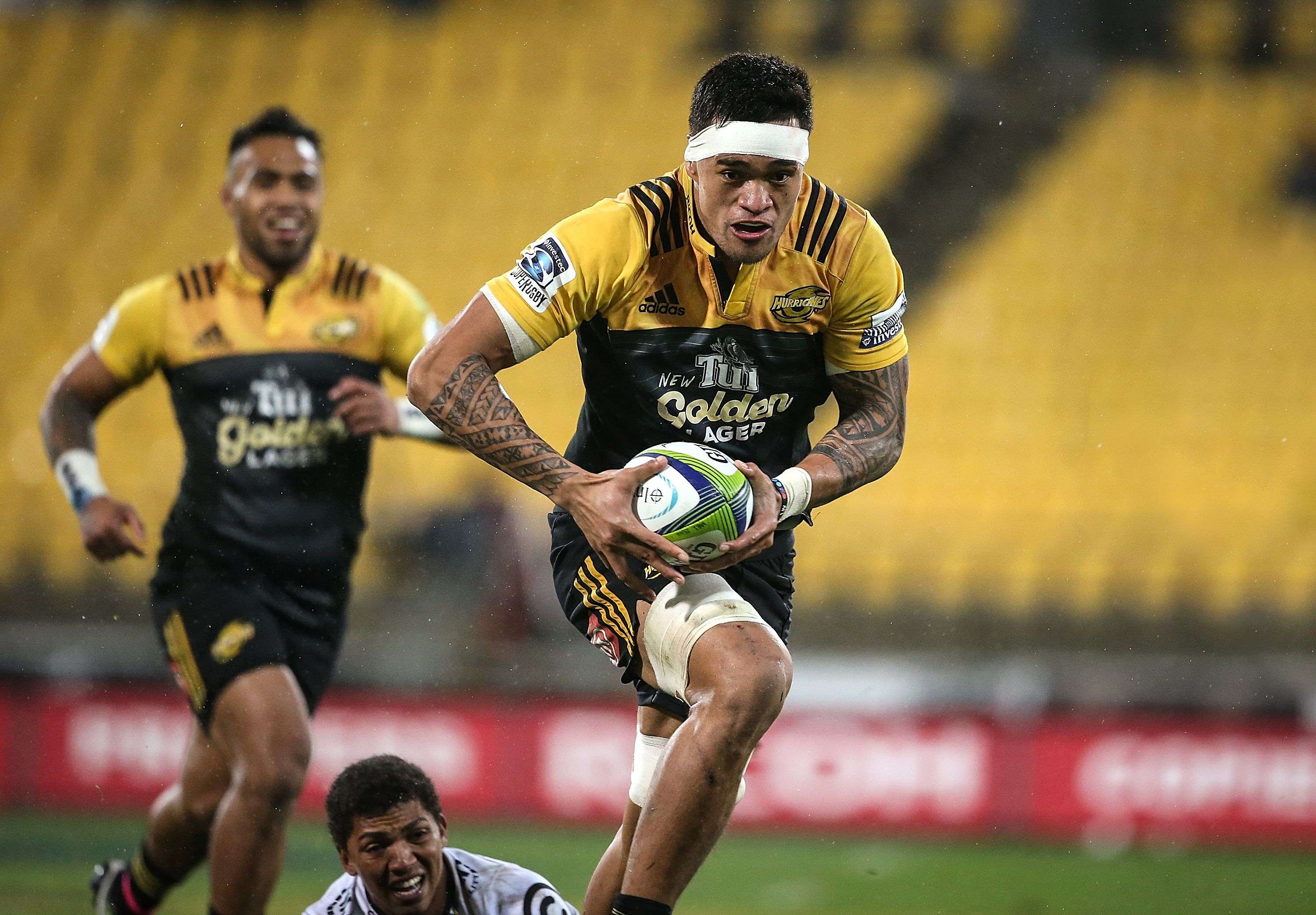 Vaea Fifita of the Hurricanes breaks away to score a try against the outclassed Coastal Sharks in Wellington. Photo: AFP
