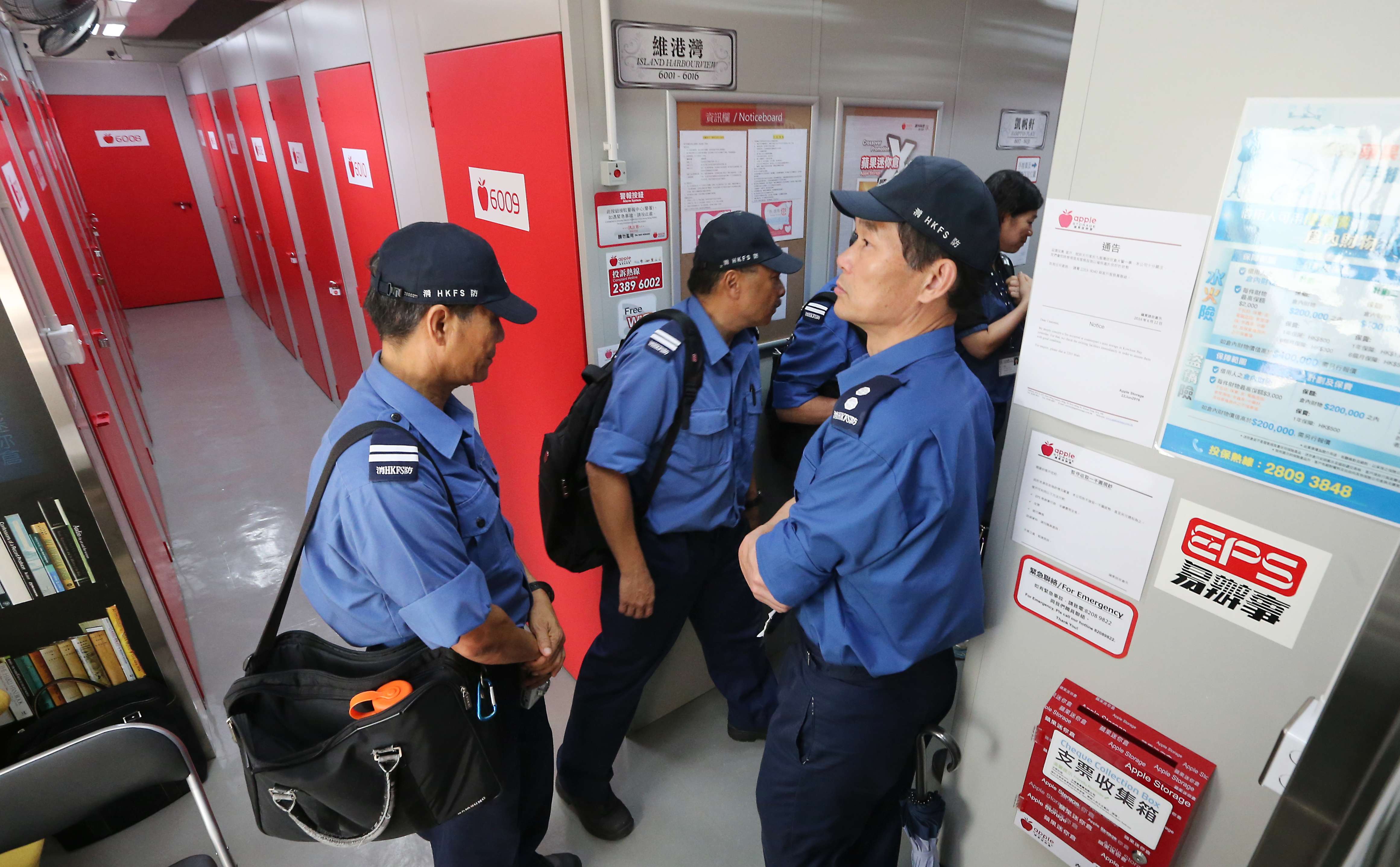 Firemen check fire protection system at a storage facility in Tai Kok Tsui. Photo: Felix Wong