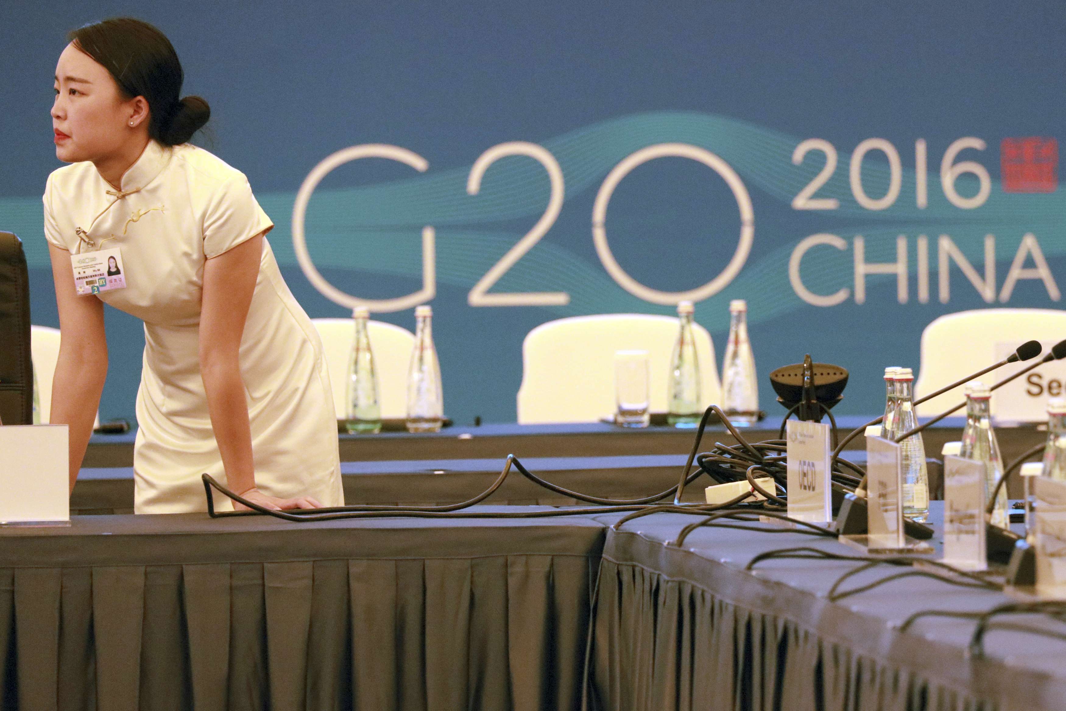 A hostess prepares for the G20 finance ministers’ meeting in Chengdu, Sichuan, last month. Hangzhou city will host the summit next month. Photo: AP