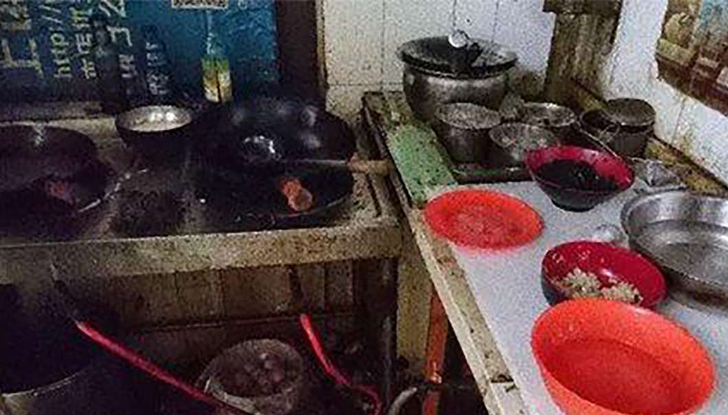 The restaurants operate in narrow, filthy kitchens. Photo: SCMP Pictures
