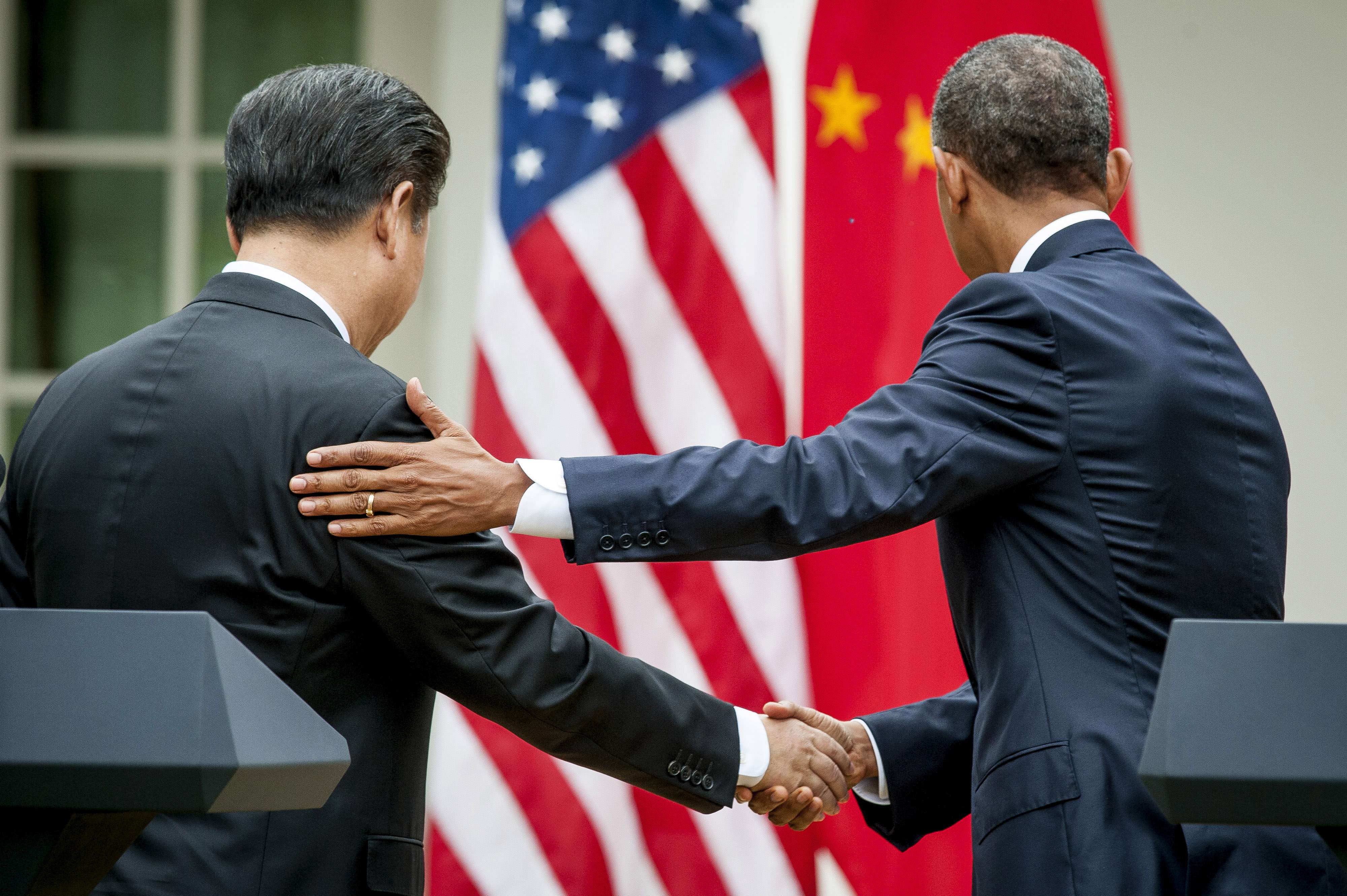 Xi Jinping, left, shakes hands with Barack Obama. The two leaders’ countries face an uneasy tussle for regional dominance. Photo: Bloomberg