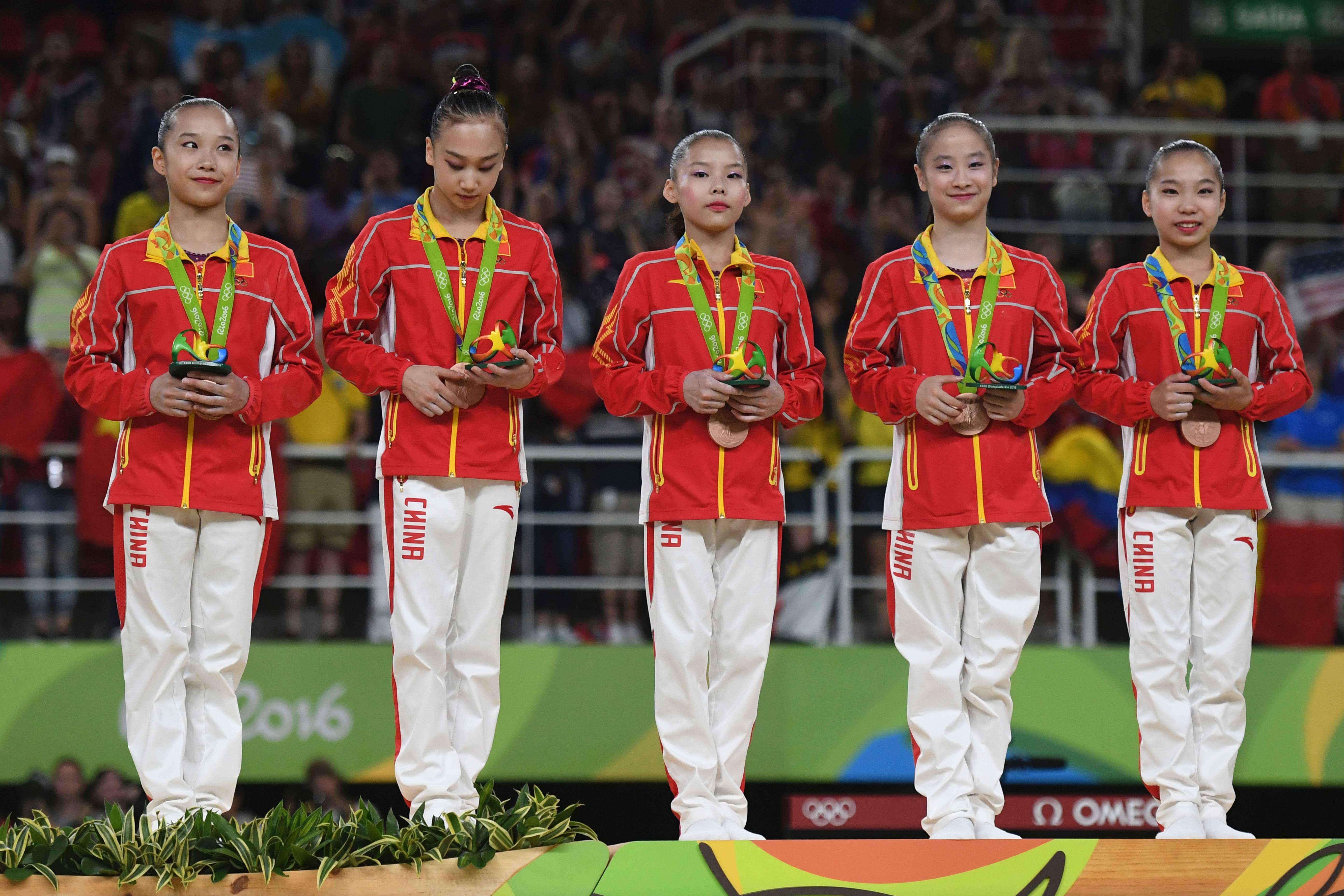 The Chinese team celebrate their bronze medal after the women's artistic gymnastics team final in Rio. Photo: AFP