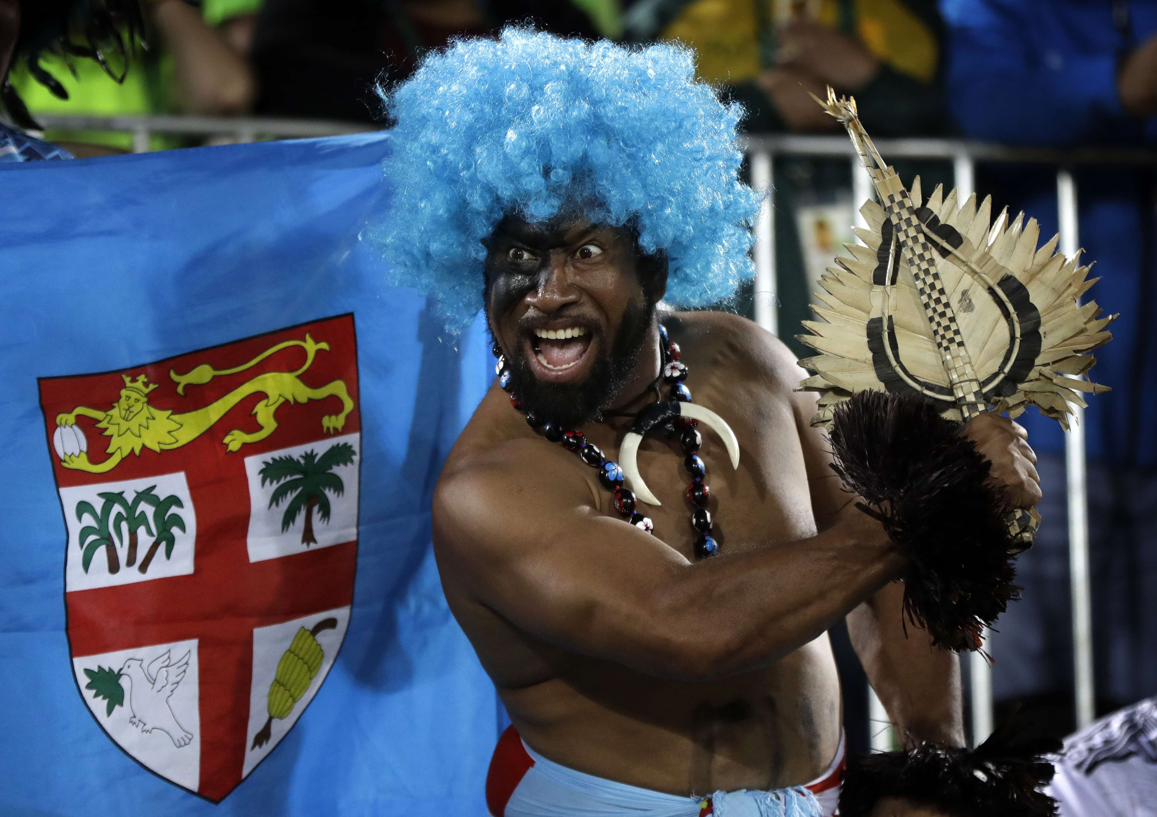 A Fiji fan celebrates his country’s gold medal after a highly successful rugby sevens campaign at the Rio Olympics. Photo: AP