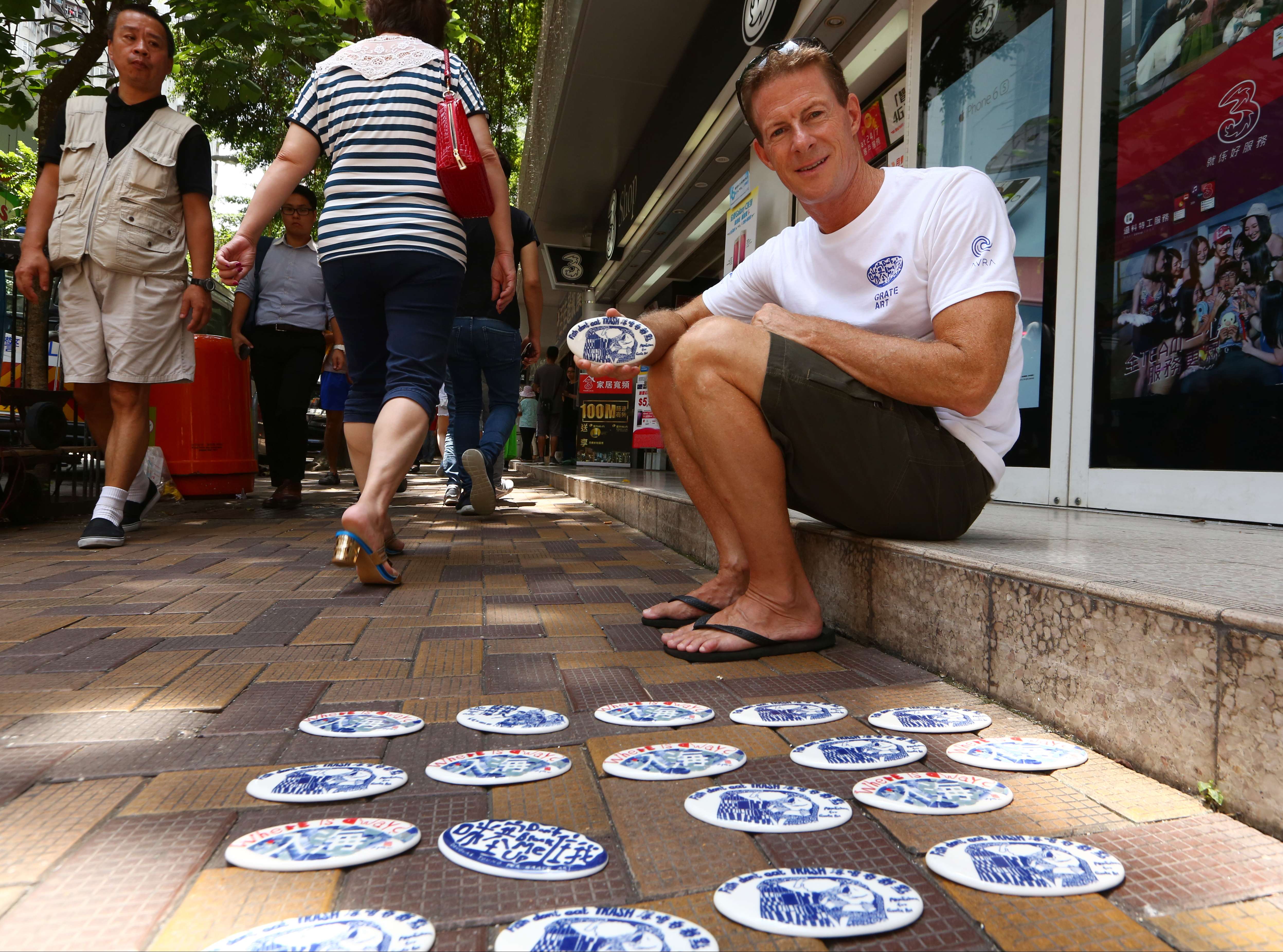Doug Woodring with his anti-rubbish tiles in Aberdeen, on the south of Hong Kong Island. Photo: Edmond So