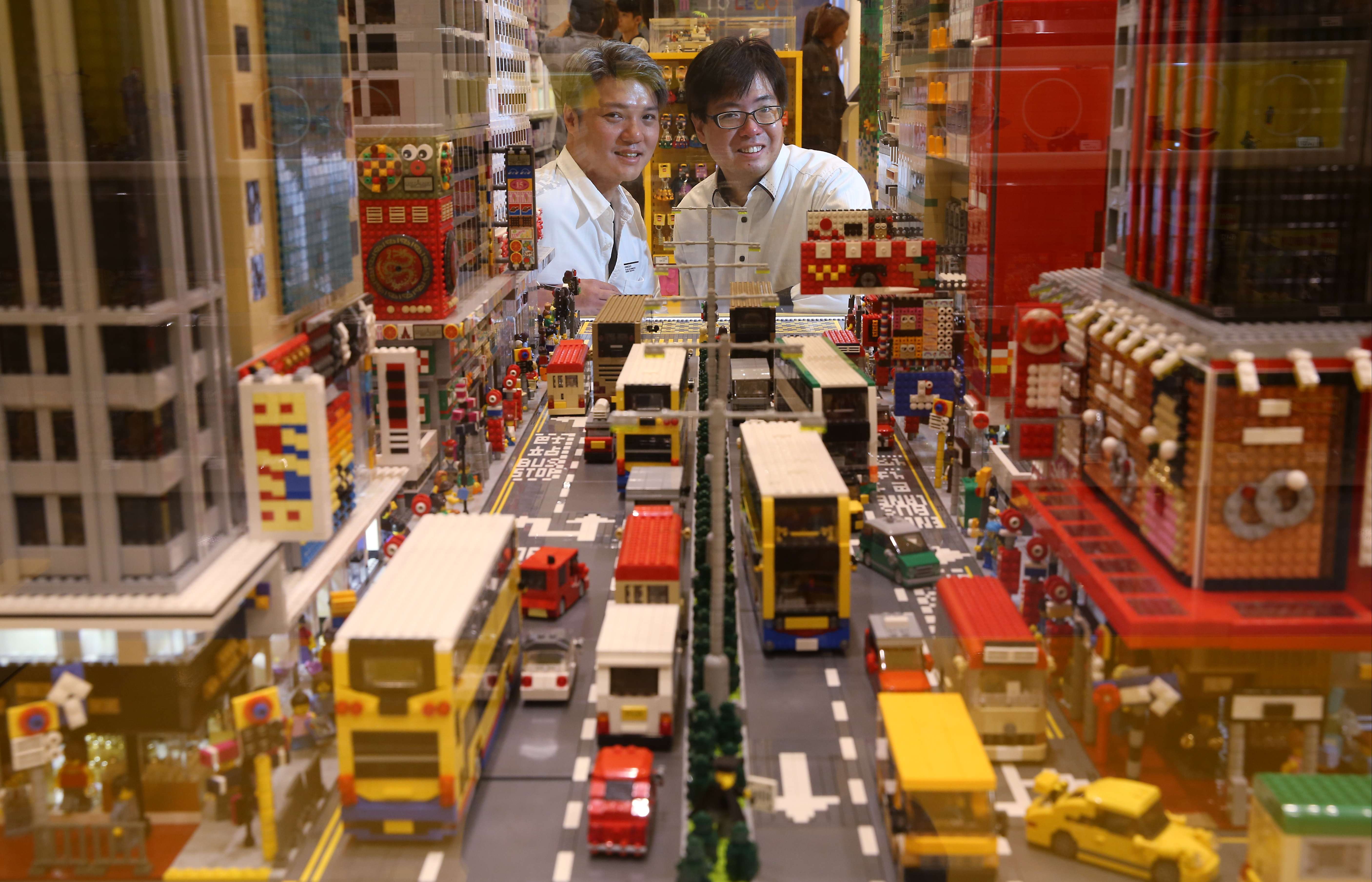 (From left) Andy Hung and Alex Hui pose for a picture with their Lego model of Mong Kok. Photo: Sam Tsang