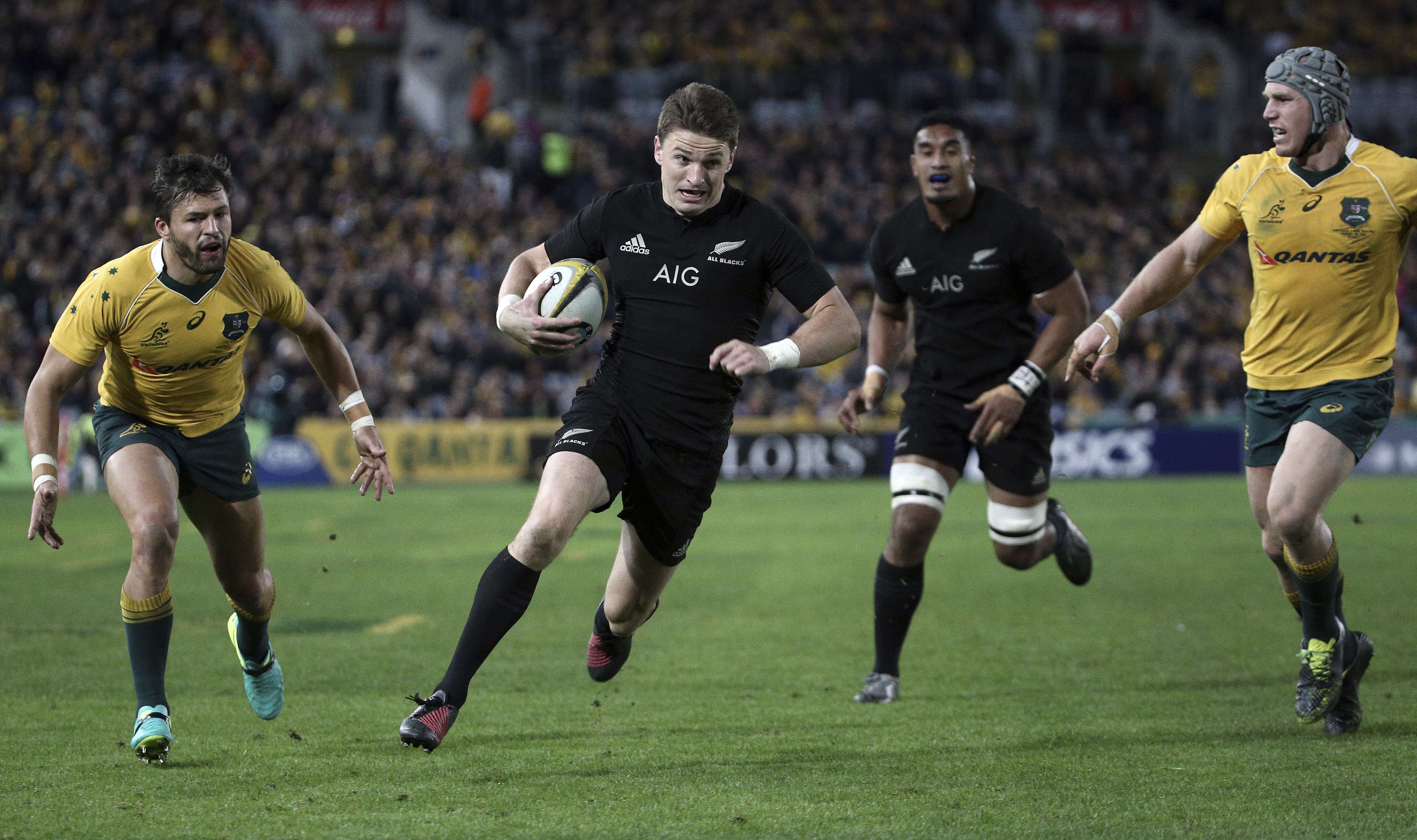 Beauden Barrett runs in to score a try for the All Blacks in their Rugby Championship clash with Australia in Sydney on Saturday. Photo: AP