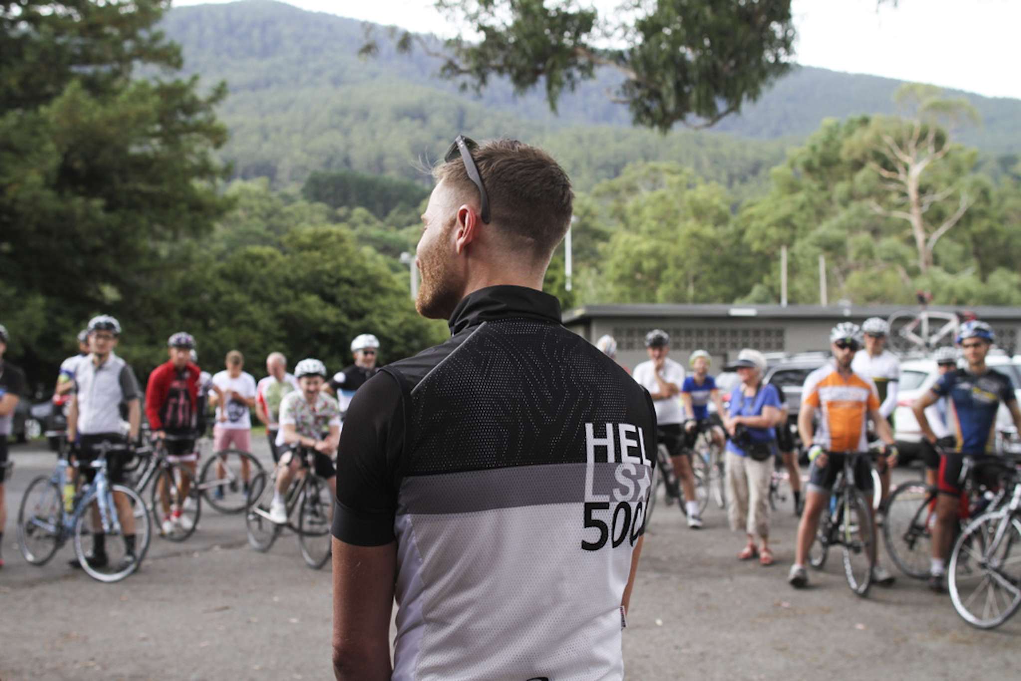 Andy van Bergen (foreground) attends the largest attempt to date when 25 people ‘Everested’ Mount Donna Buang in Australia. Twenty-two were women. More than 300 riders came out to cheer them on.